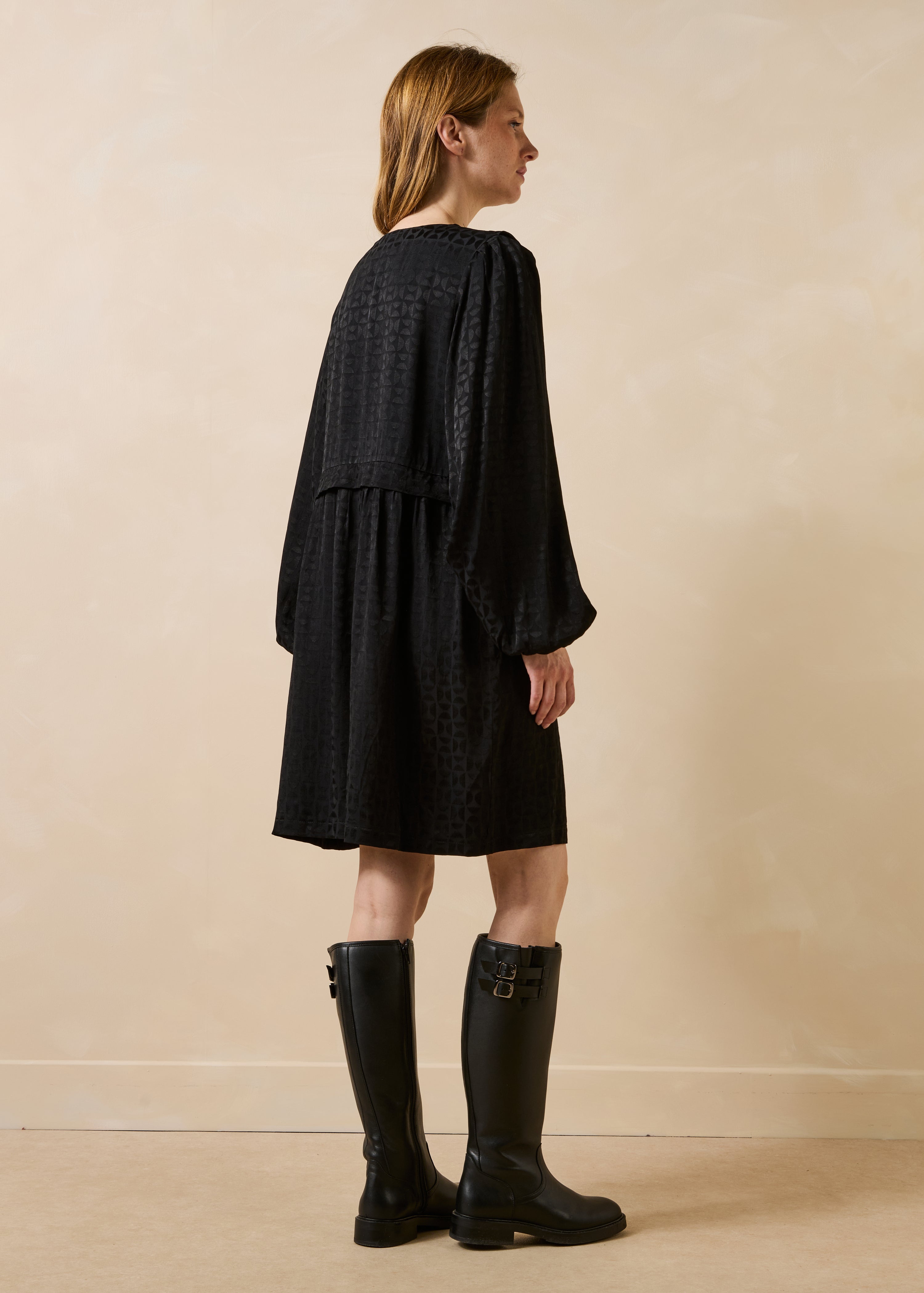 Black short dress with long sleeves and Tunisian neckline