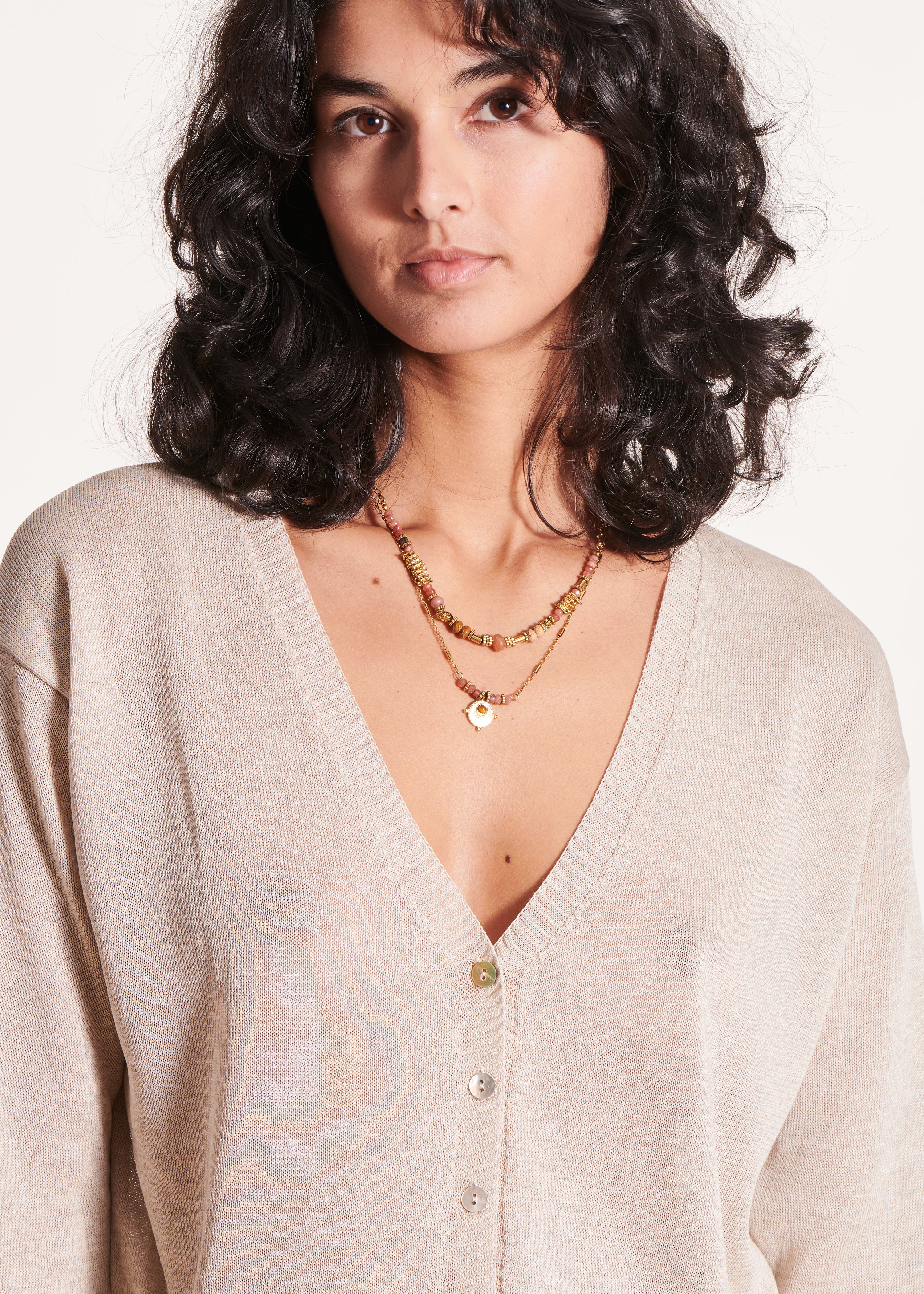 Kort beige vest, lange mouwen, V-hals