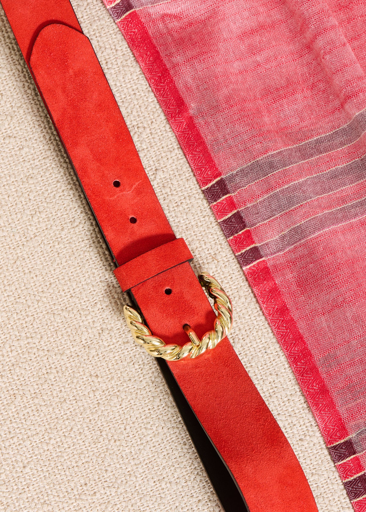 Ceinture orange en cuir boucle twistée