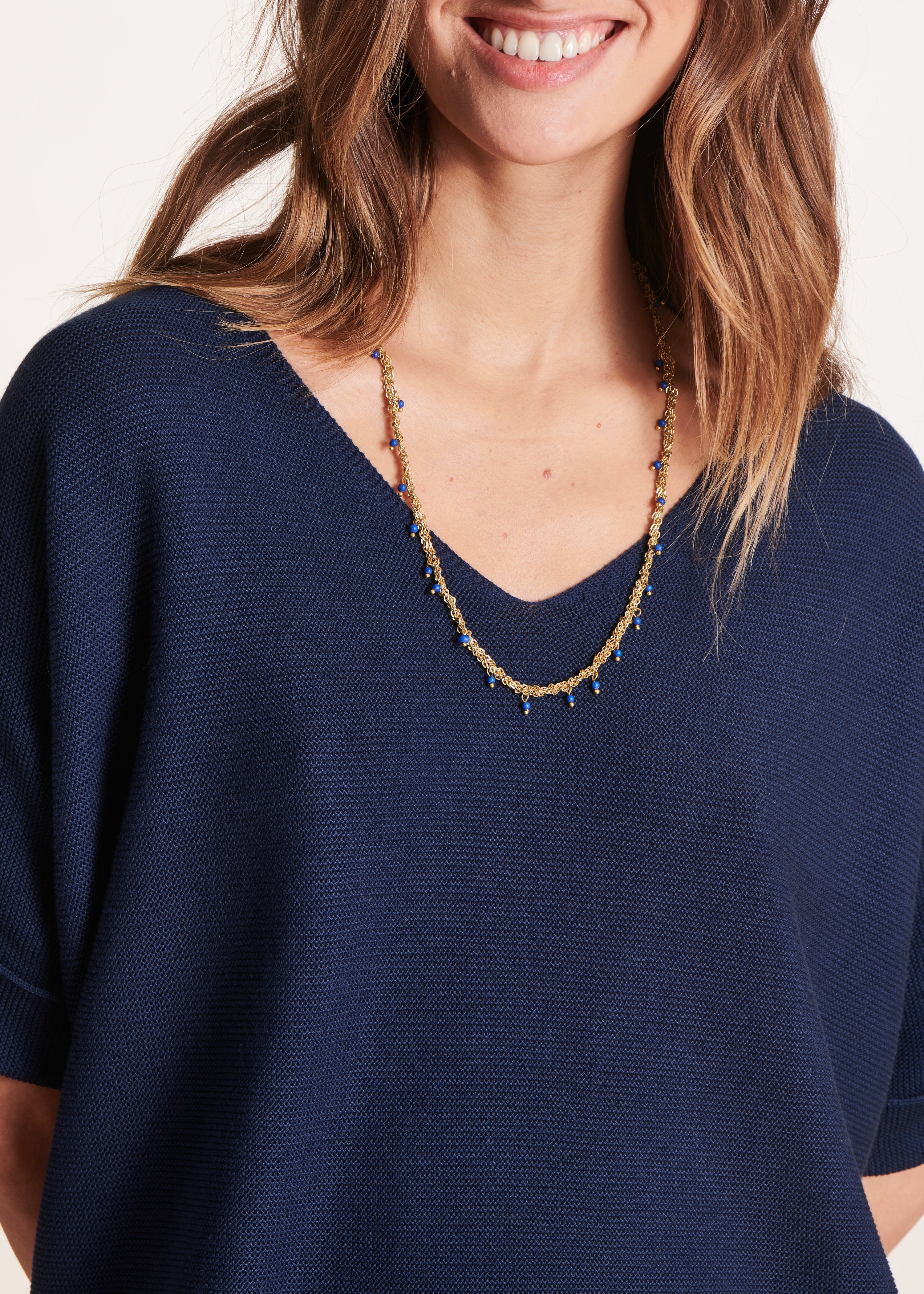 Navy blue short-sleeved V-neck sweater