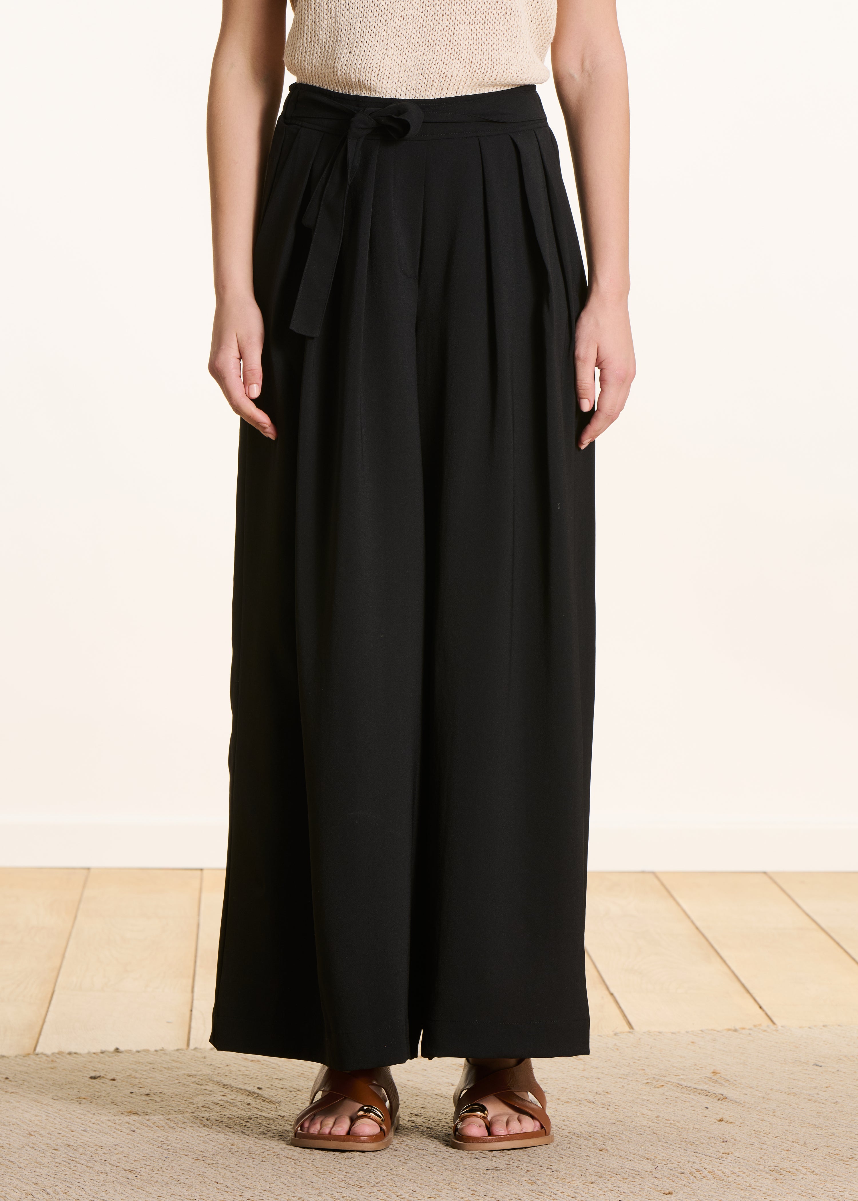 Wide black pleated pants with elastic waist