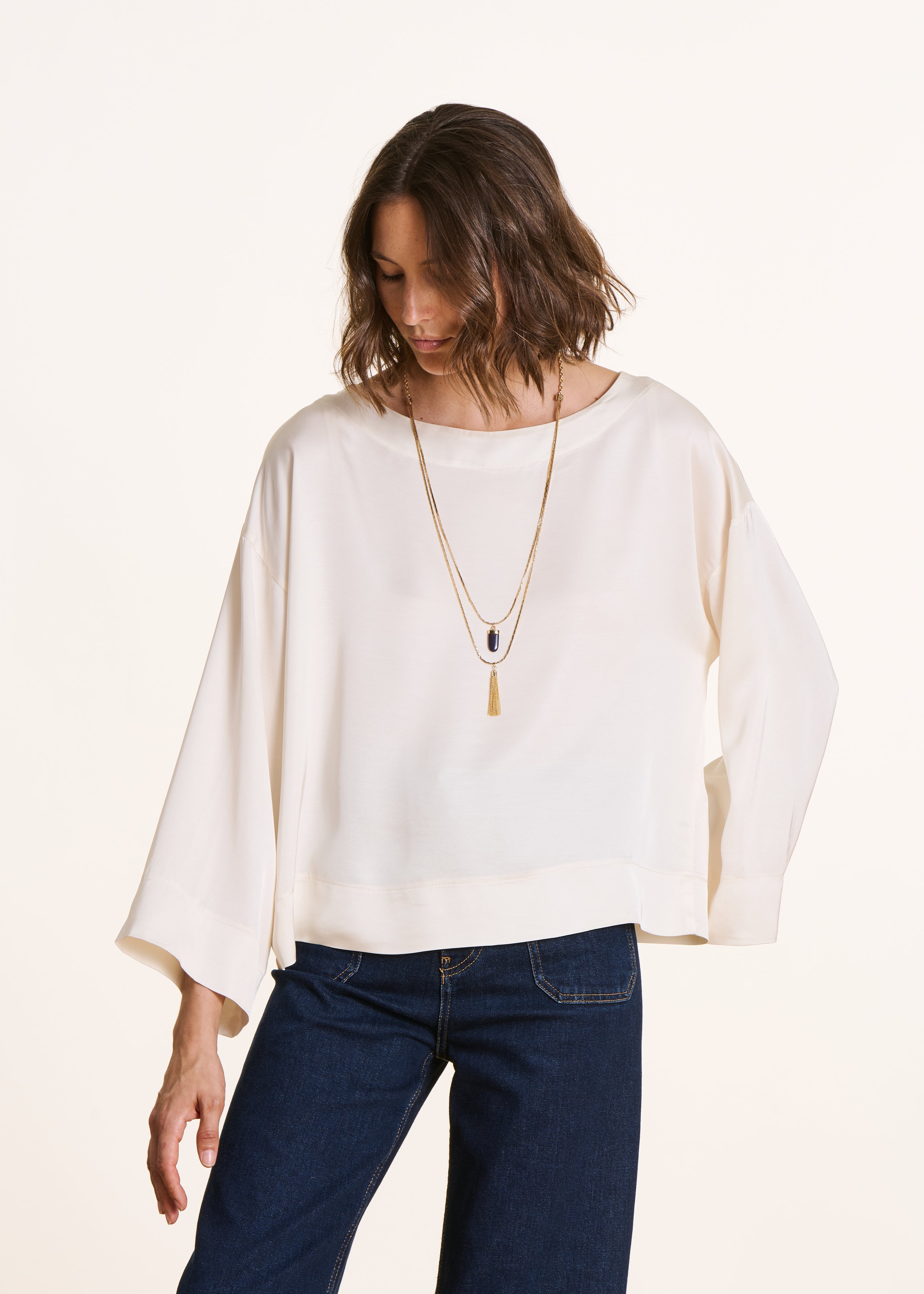 Loose off-white satin top with long sleeves