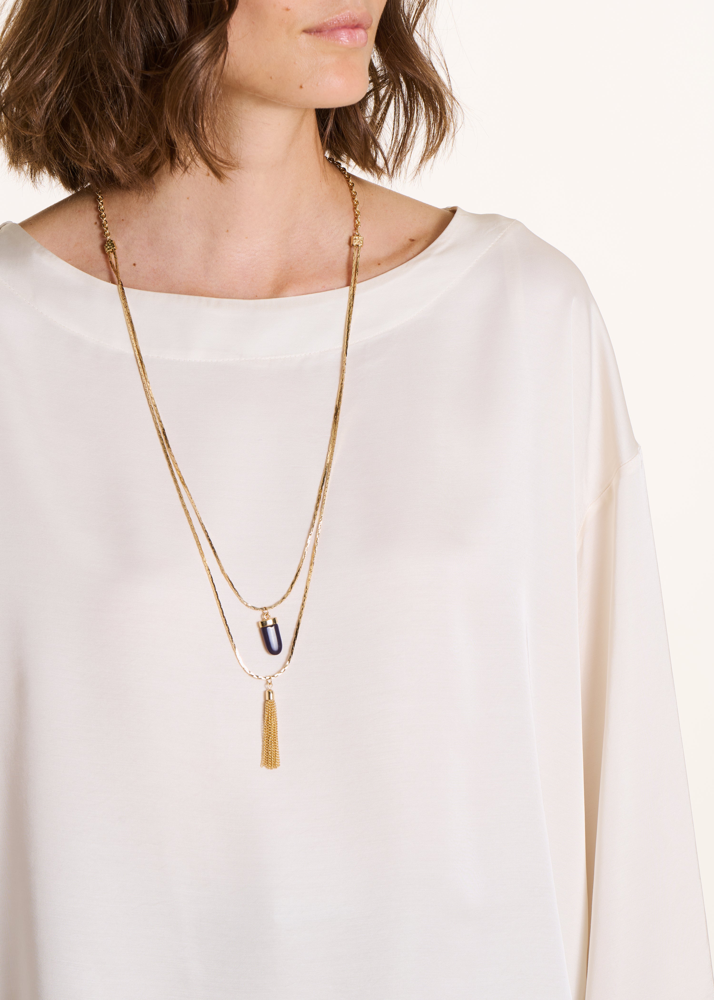 Loose off-white satin top with long sleeves