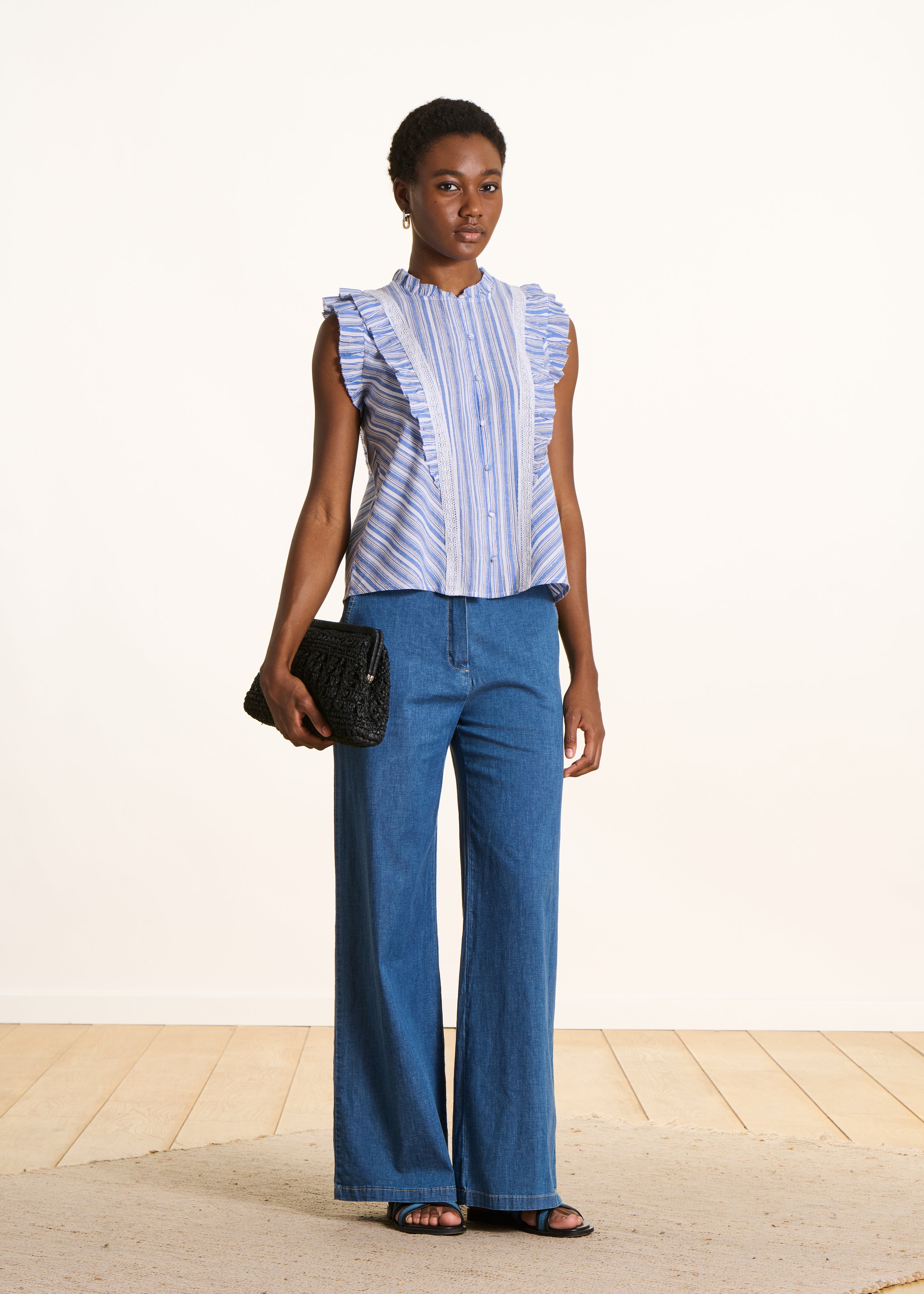 Blue striped sleeveless ruffle shirt