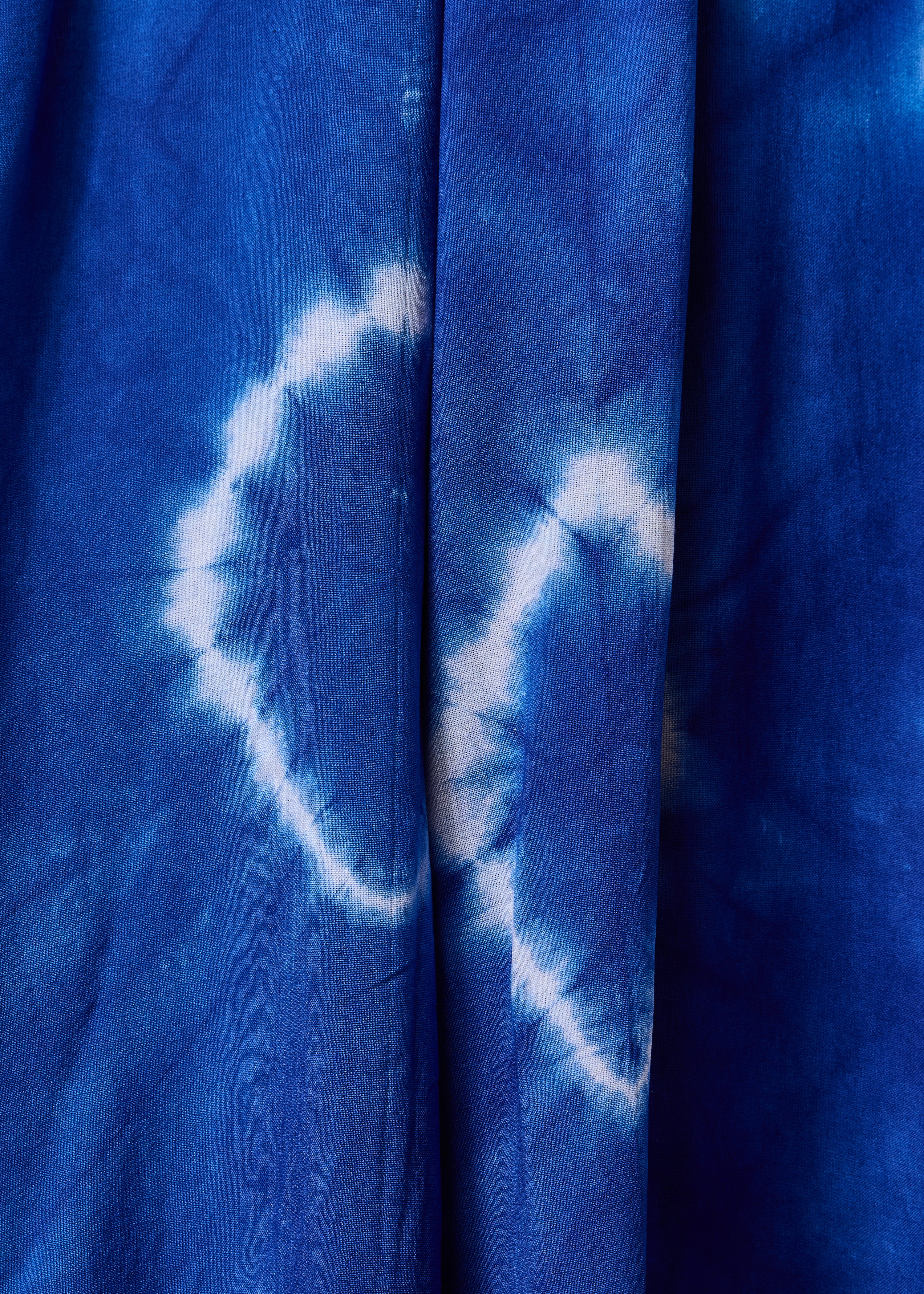 Tuta ampia blu con spalline stampate