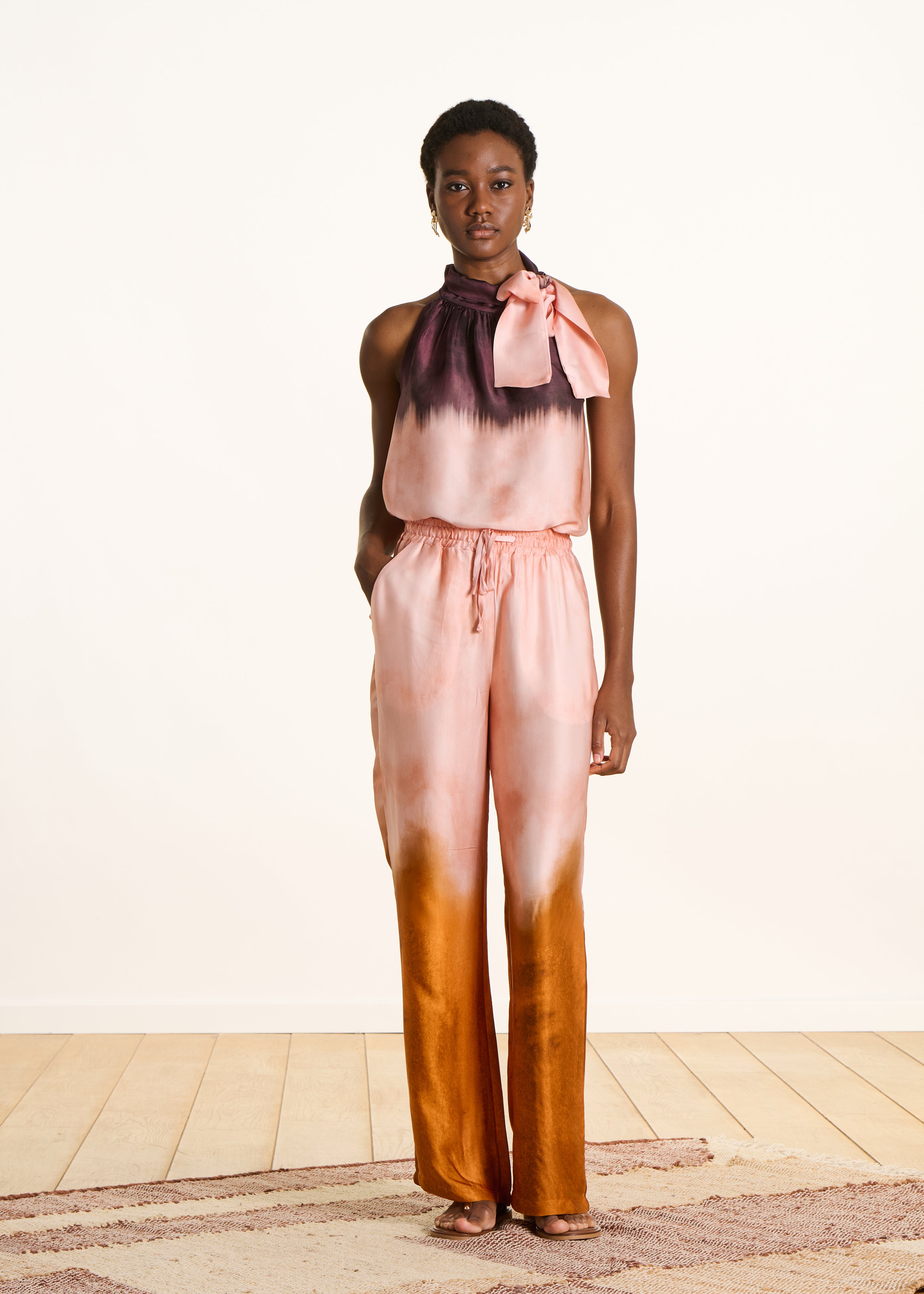 Wide pink satin pants with tie-dye print