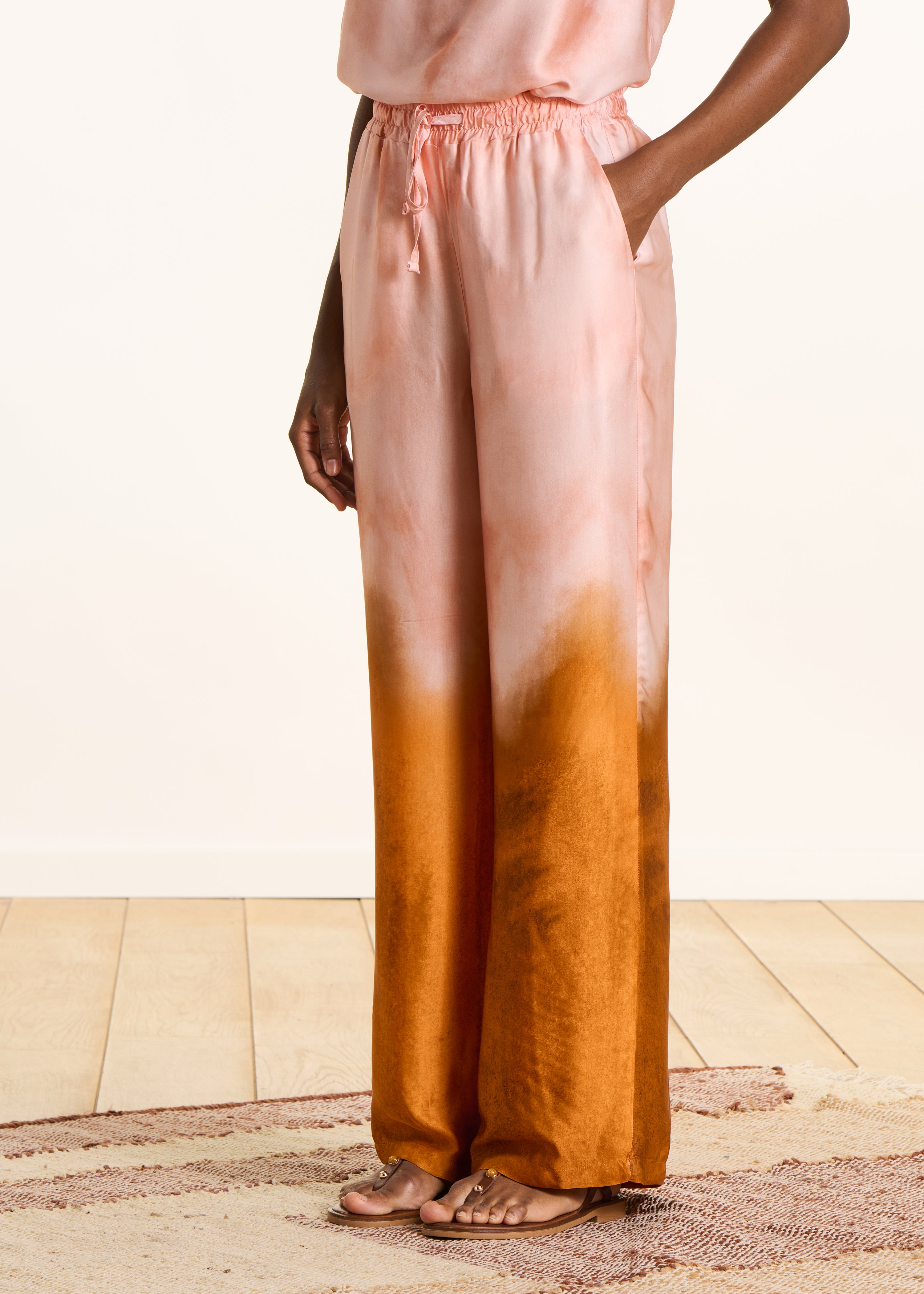 Wide pink satin pants with tie-dye print