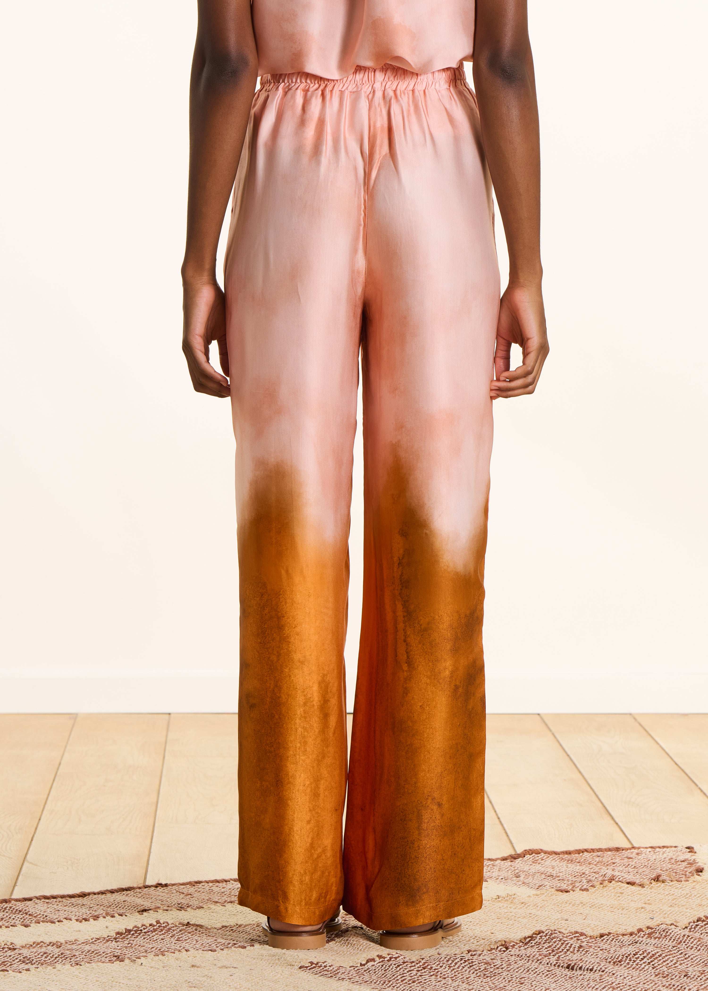 Wide pink satin pants with tie-dye print