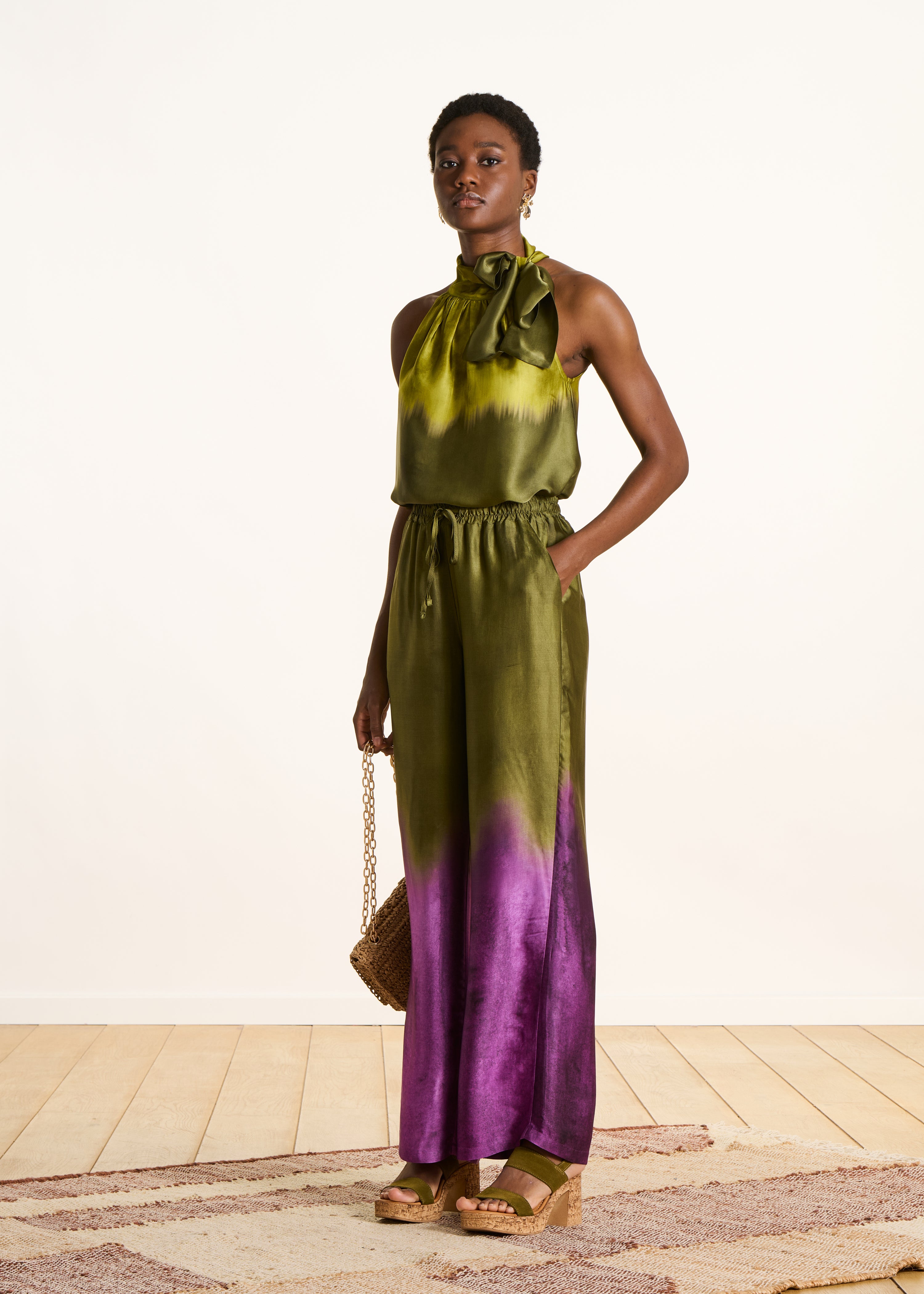 Wide green satin pants with tie-dye print