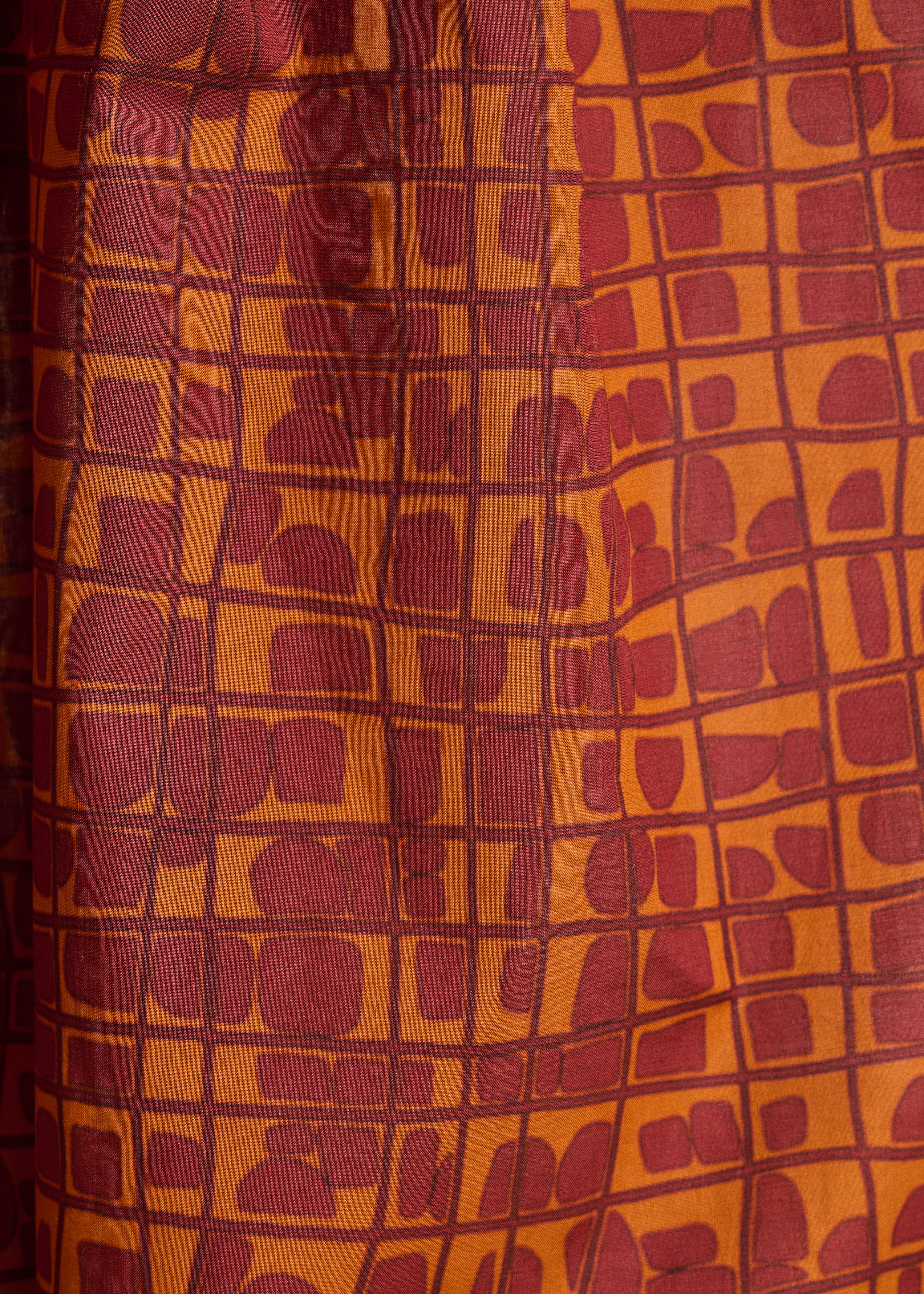 7/8 broek met grafische print in bruin en oranje