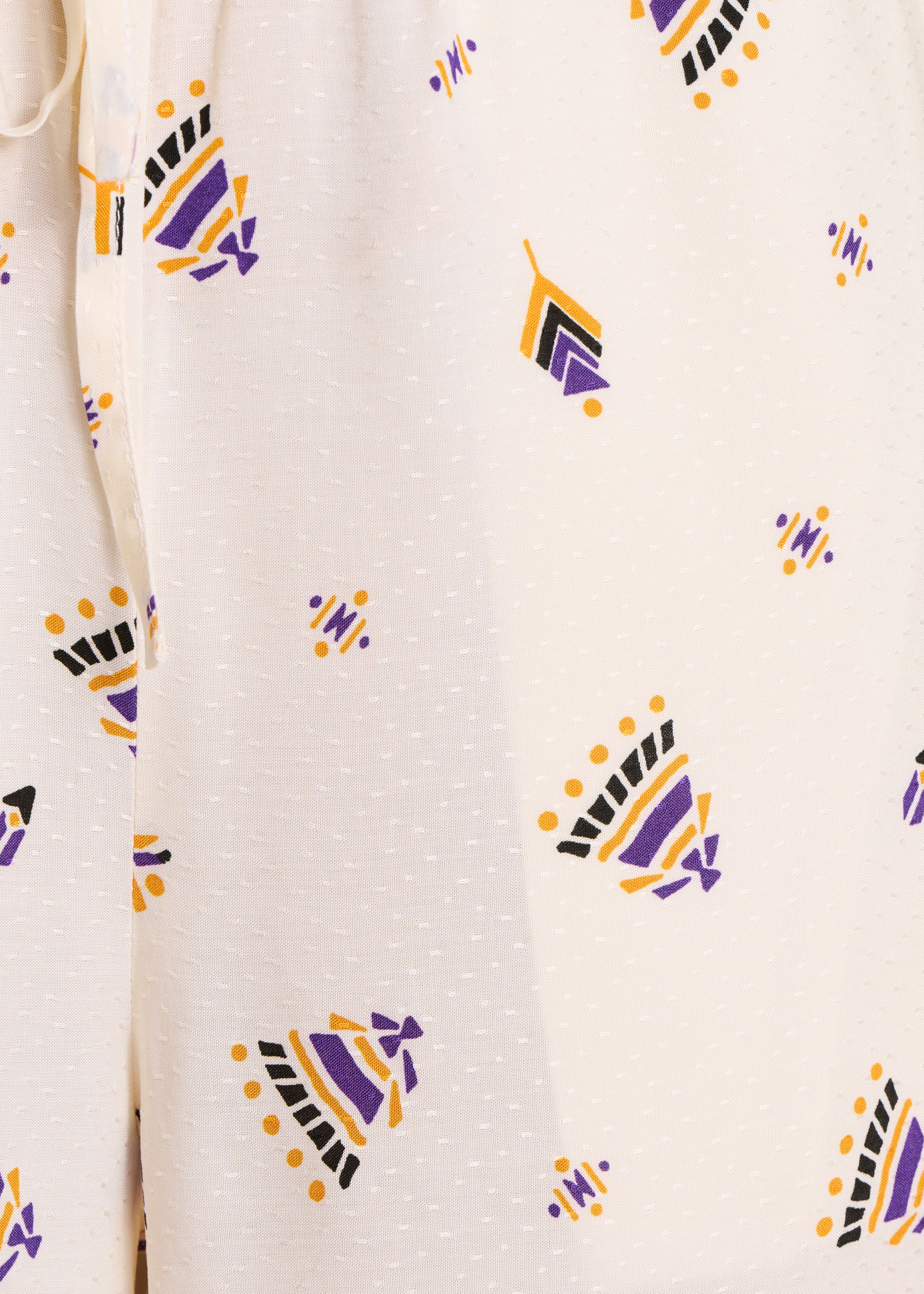 Pantalón ancho écru con estampado