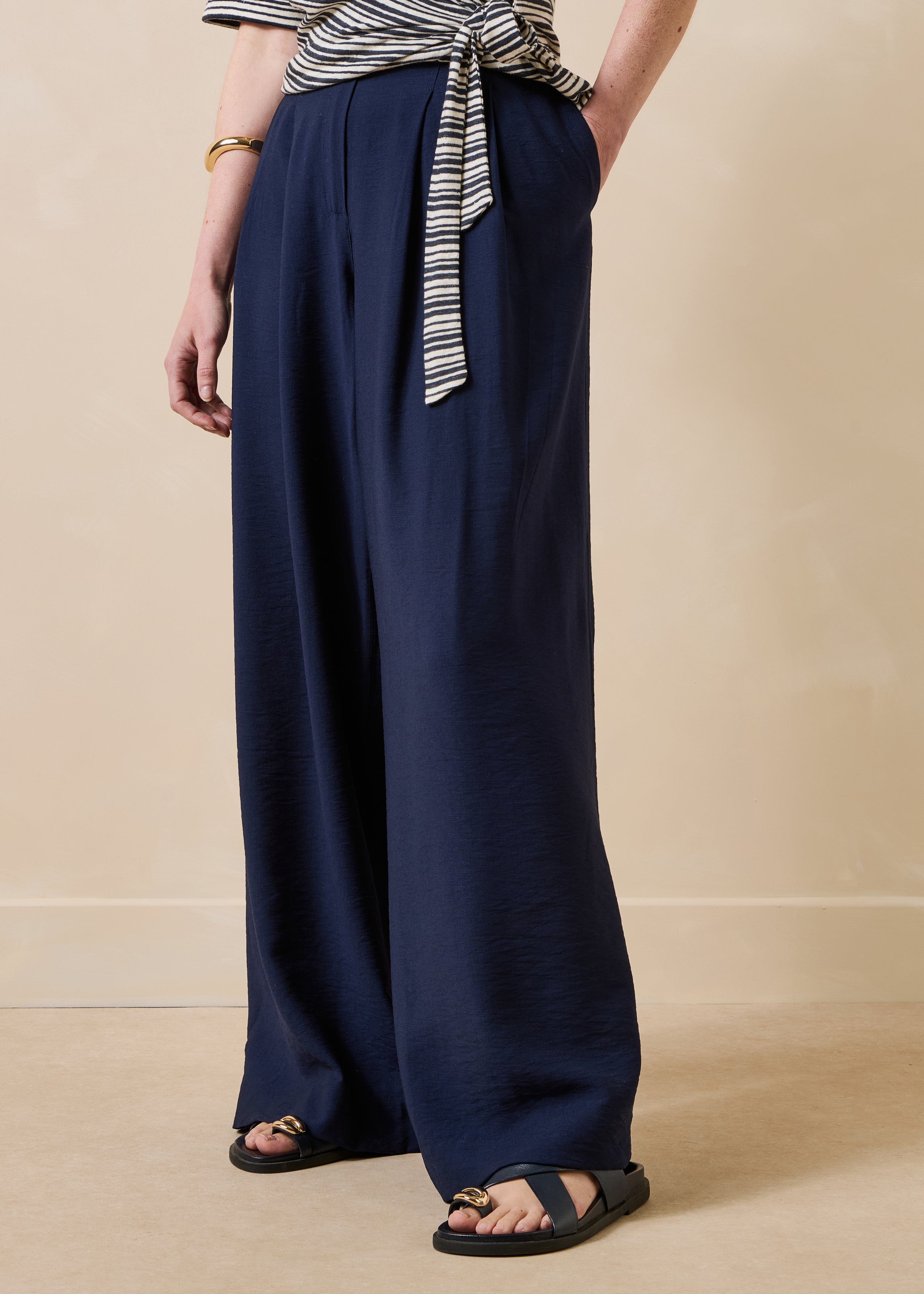 Long high-waisted navy blue trousers