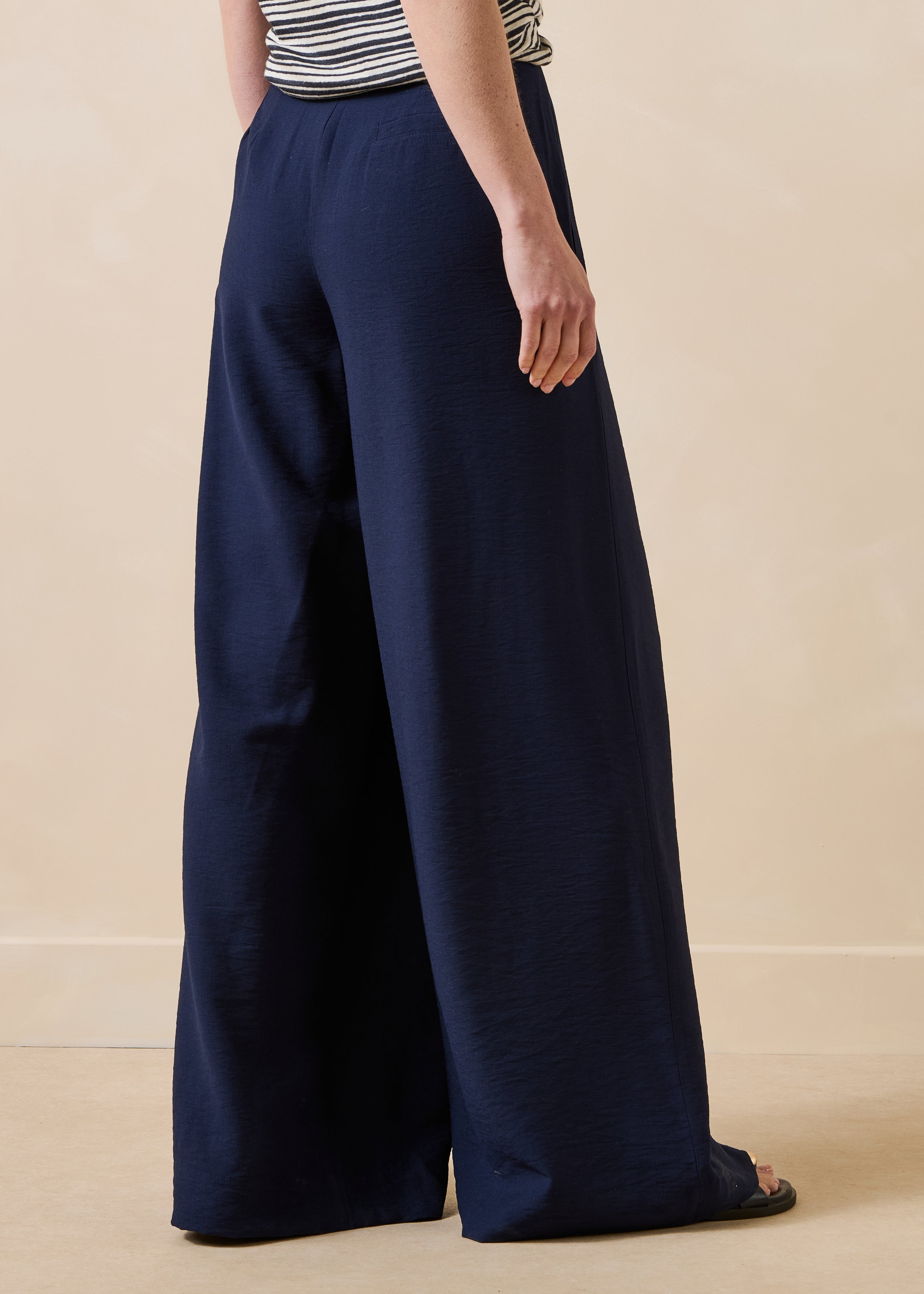 Long high-waisted navy blue trousers