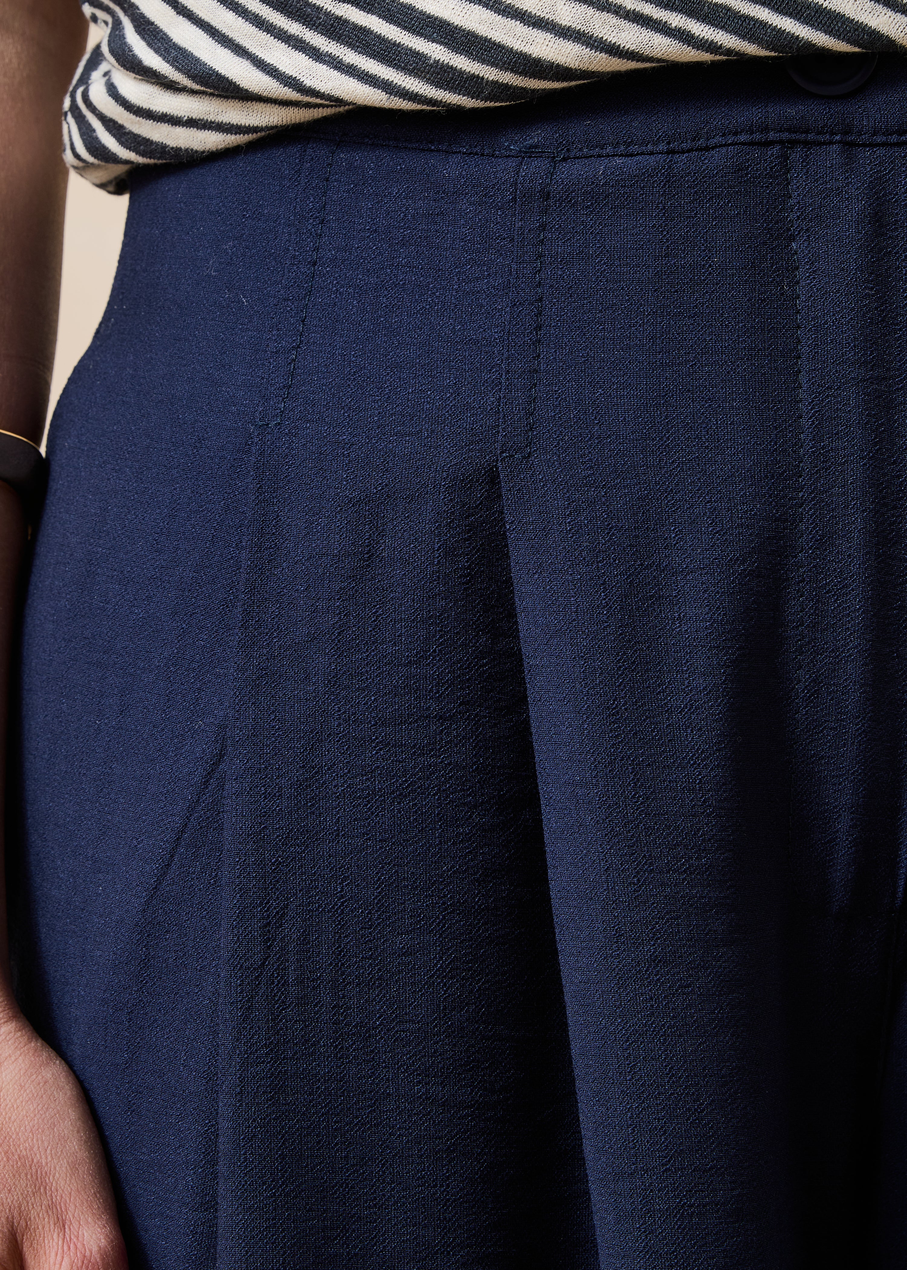 Long high-waisted navy blue trousers