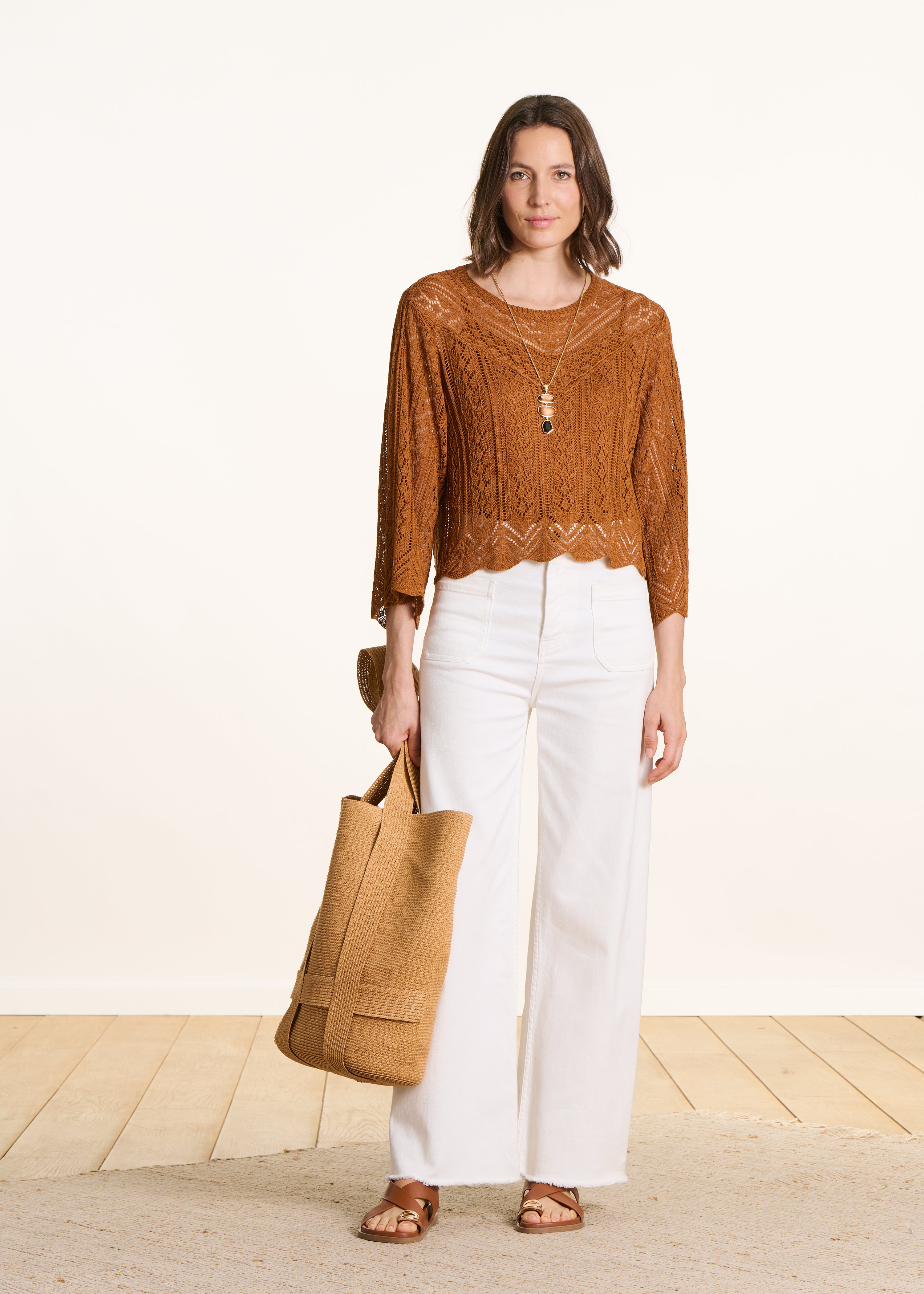 Short brown sweater in fine openwork knit