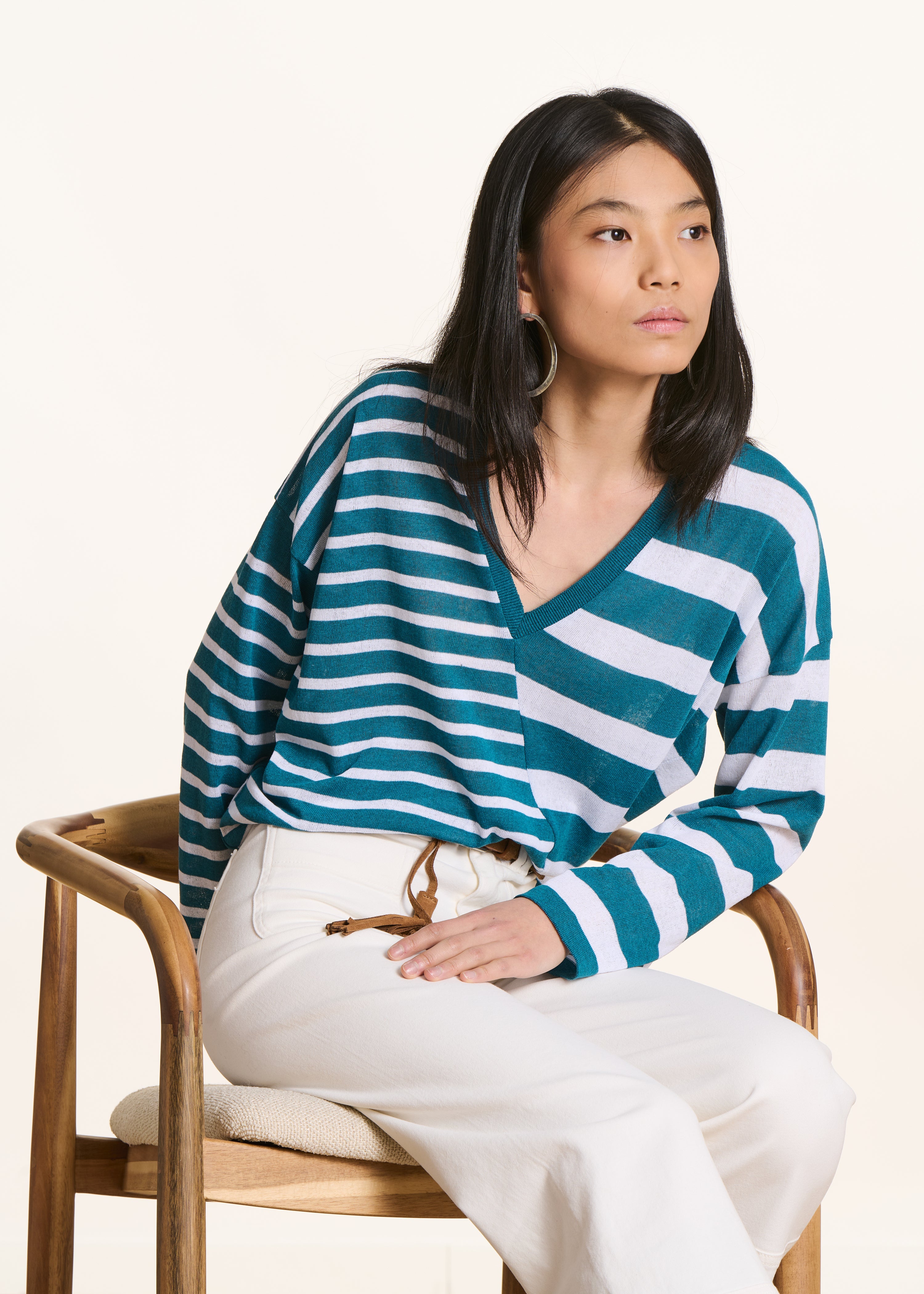 Loose petrol blue sweater with white stripes in fine knit, V-neck
