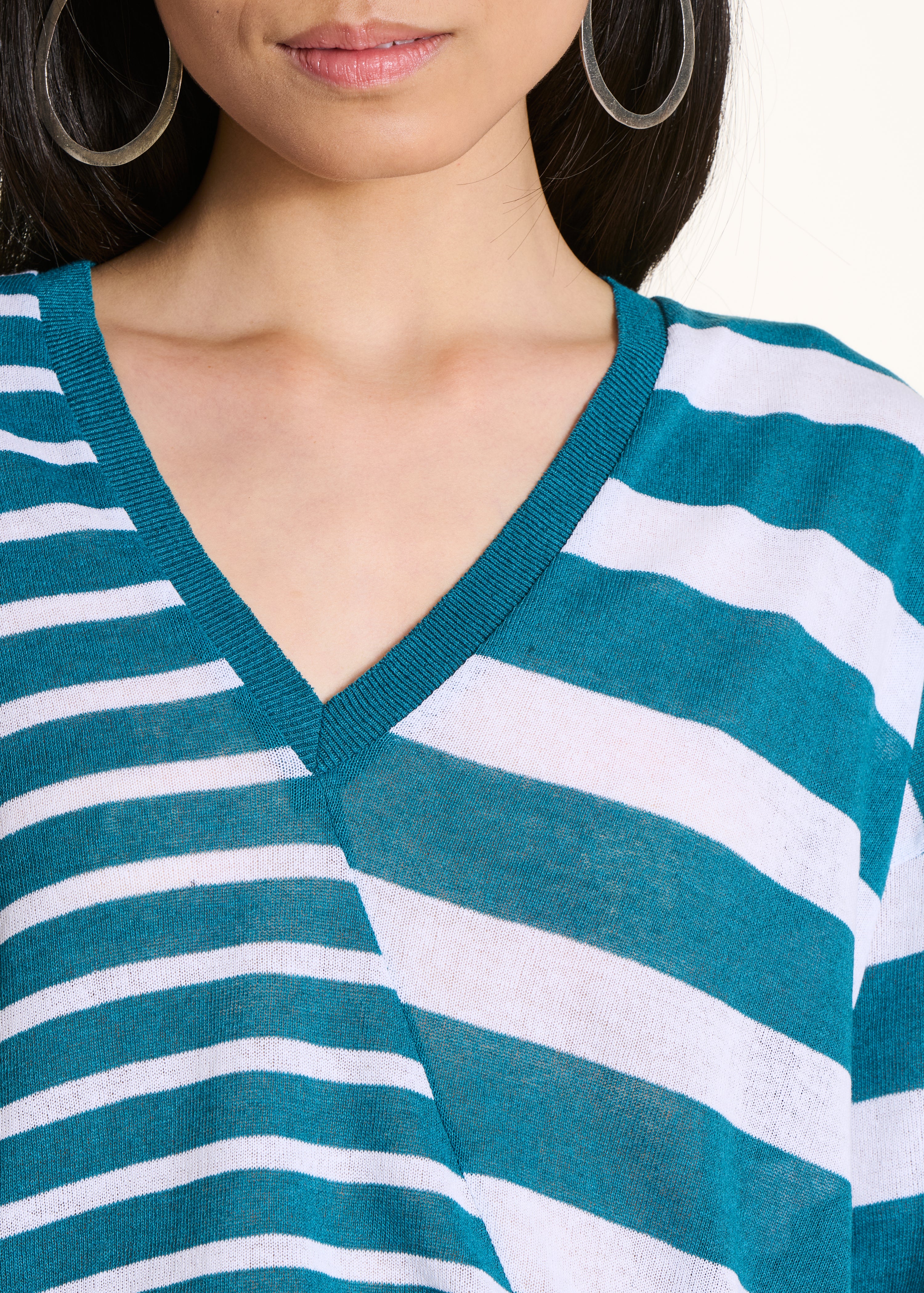Loose petrol blue sweater with white stripes in fine knit, V-neck