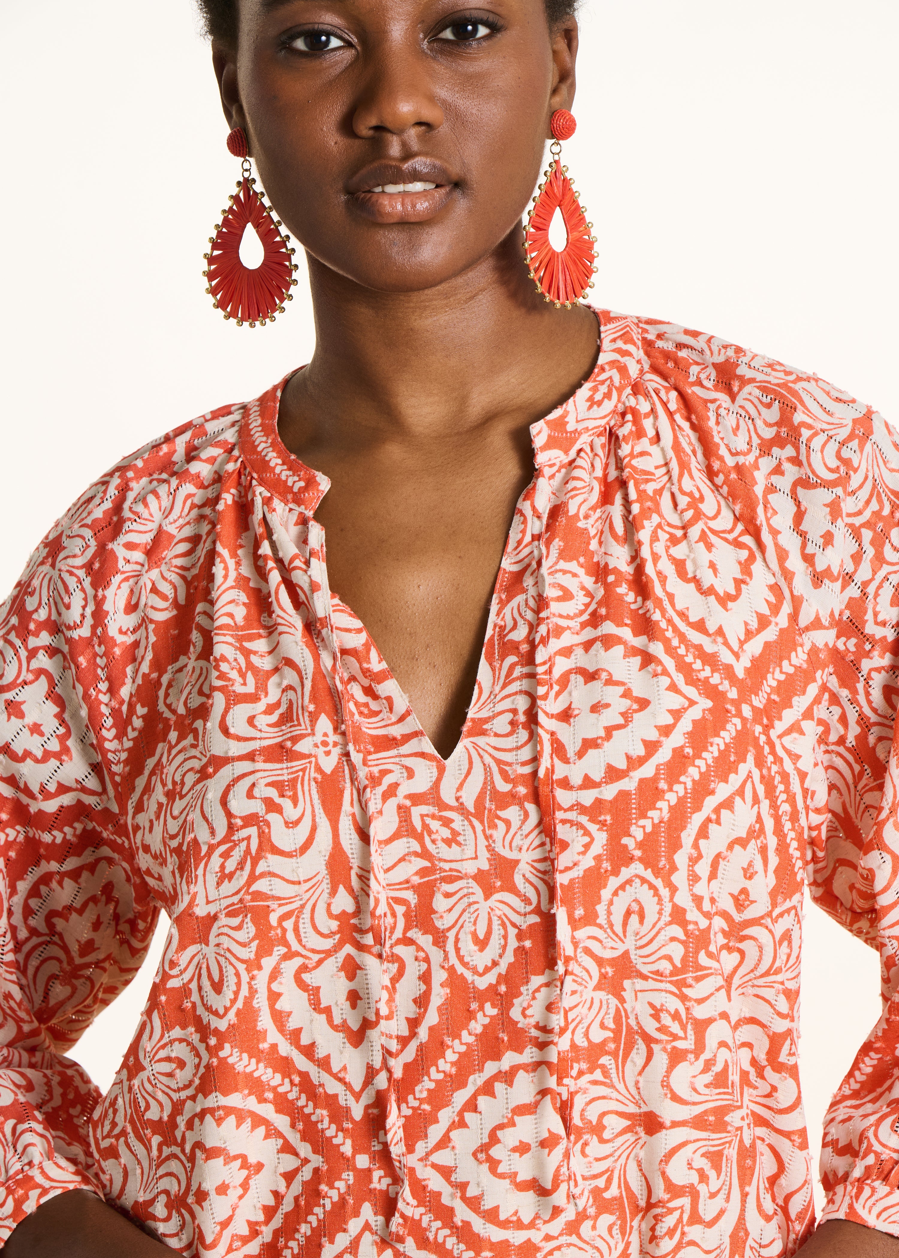 Orange short openwork dress with floral print