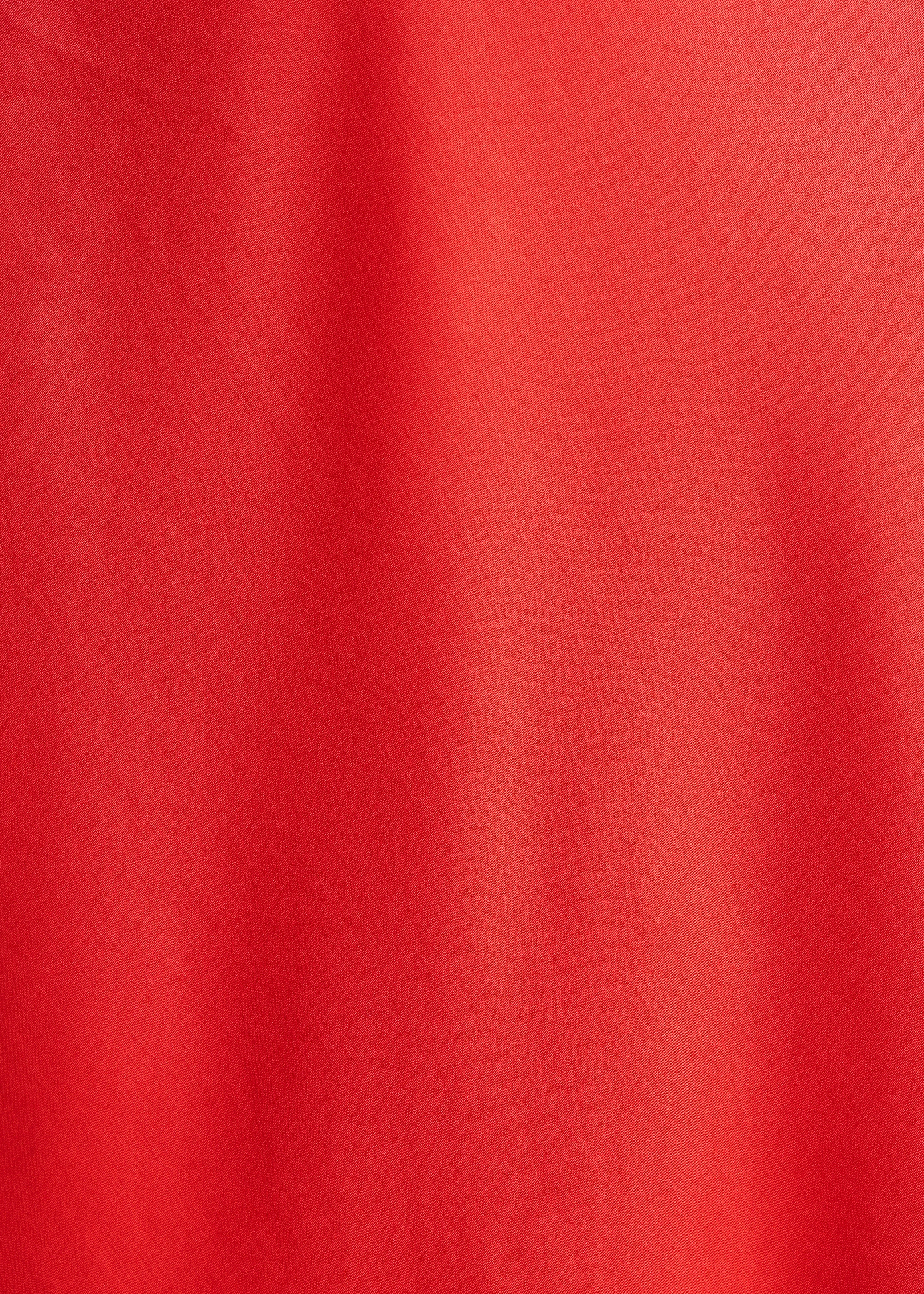 Flowing long orange satin sleeveless dress