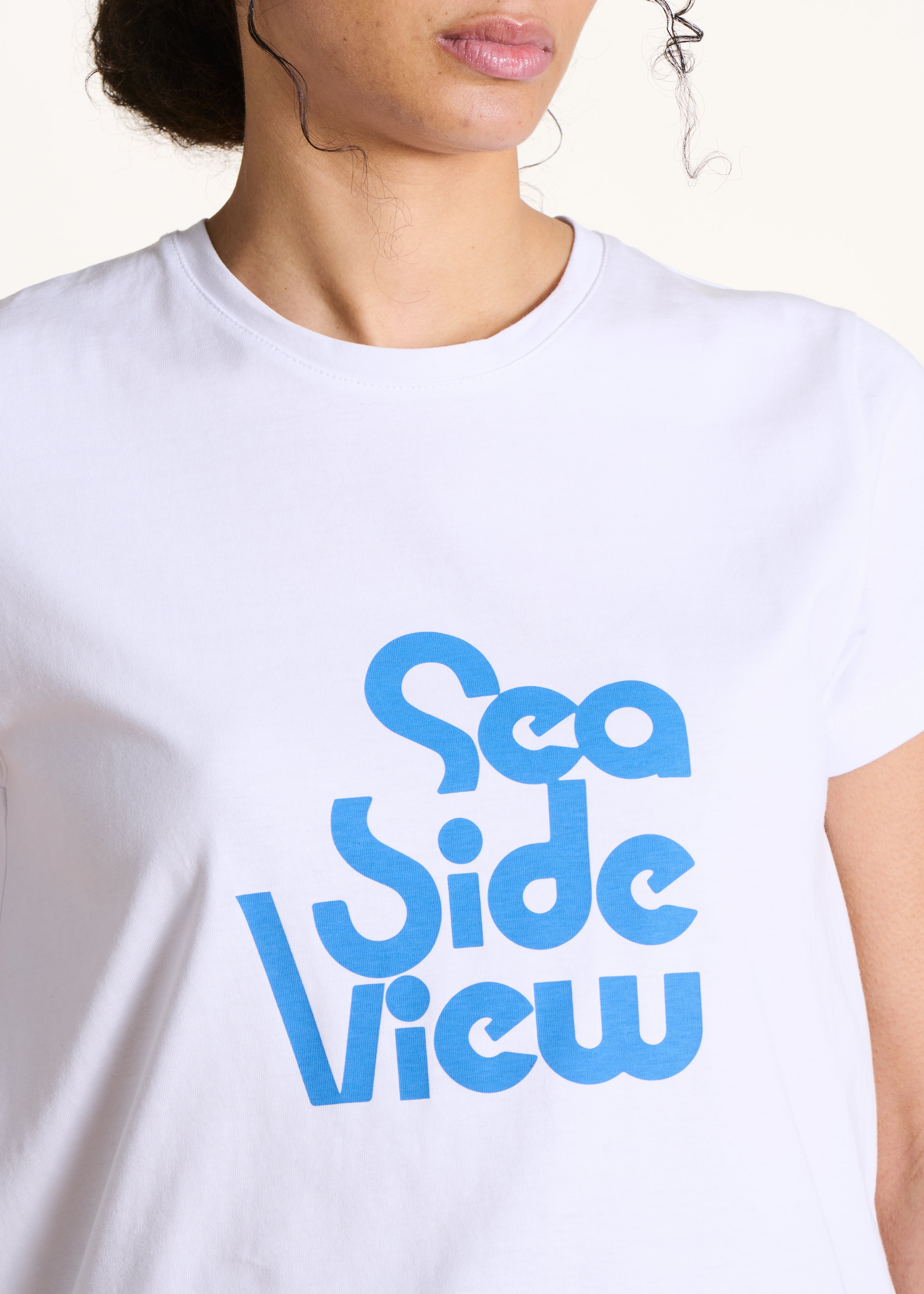 Wit losvallend T-shirt met tekst van biologisch katoen