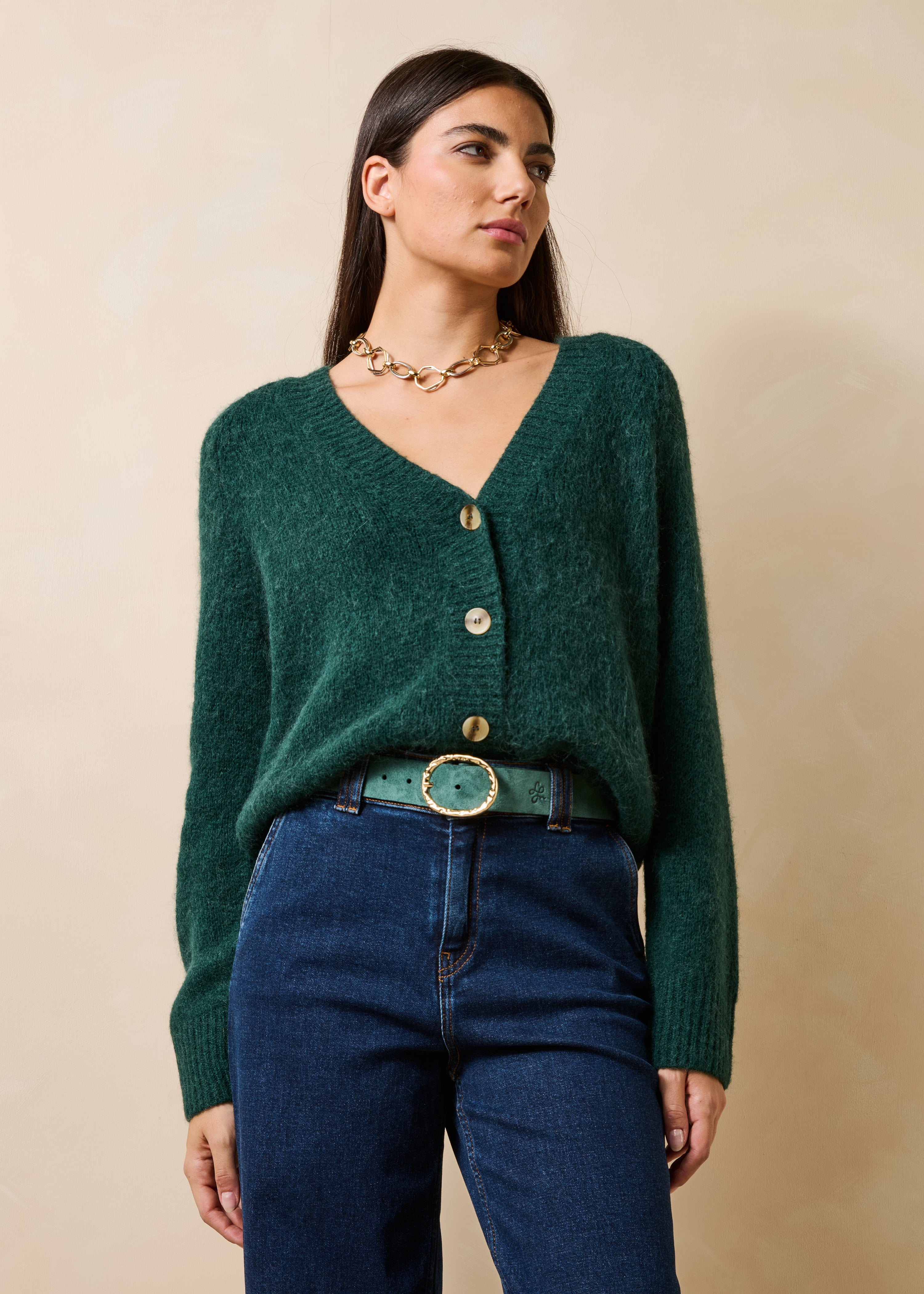 Groene gilet met lange mouwen en V-hals
