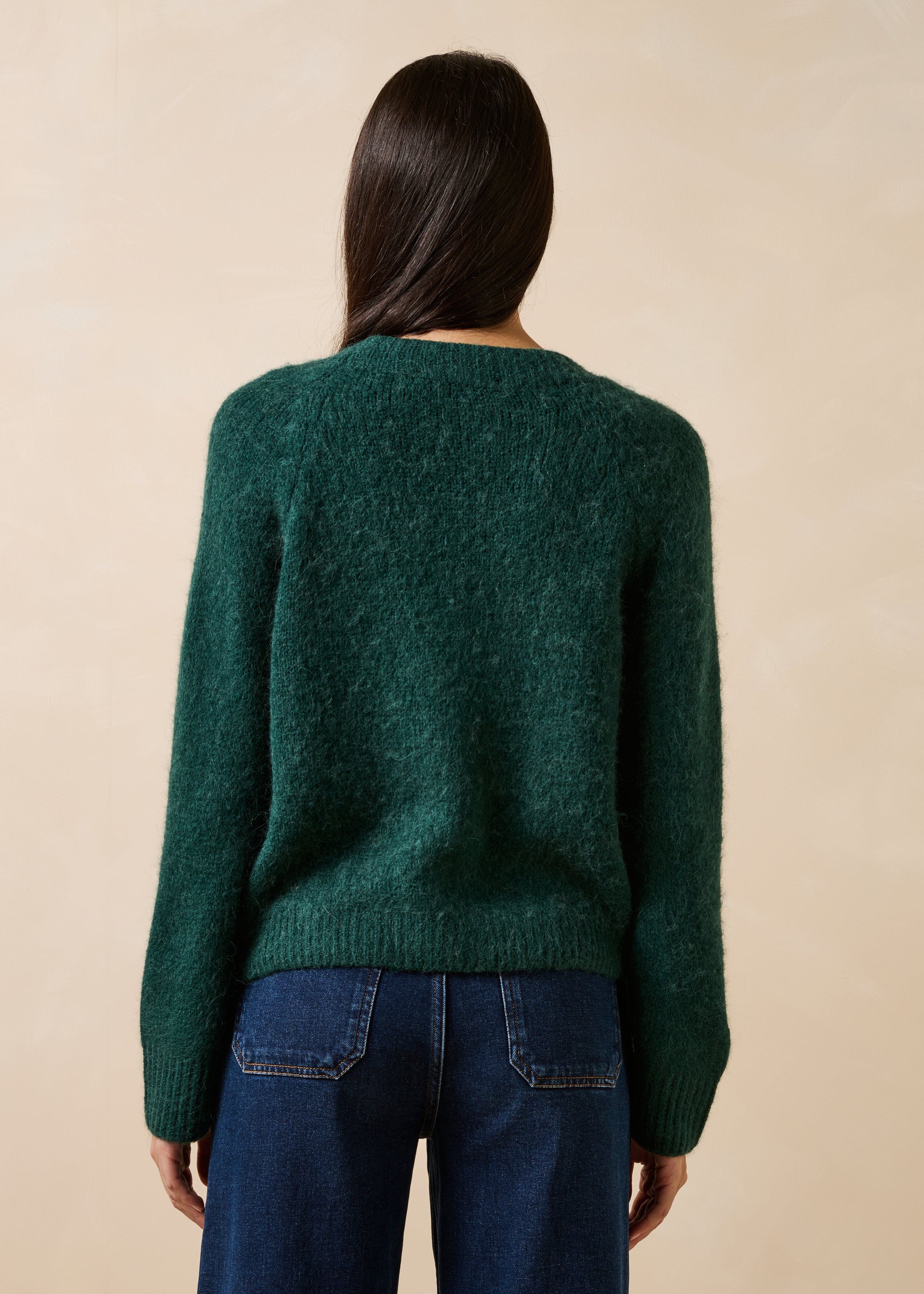 Groene gilet met lange mouwen en V-hals