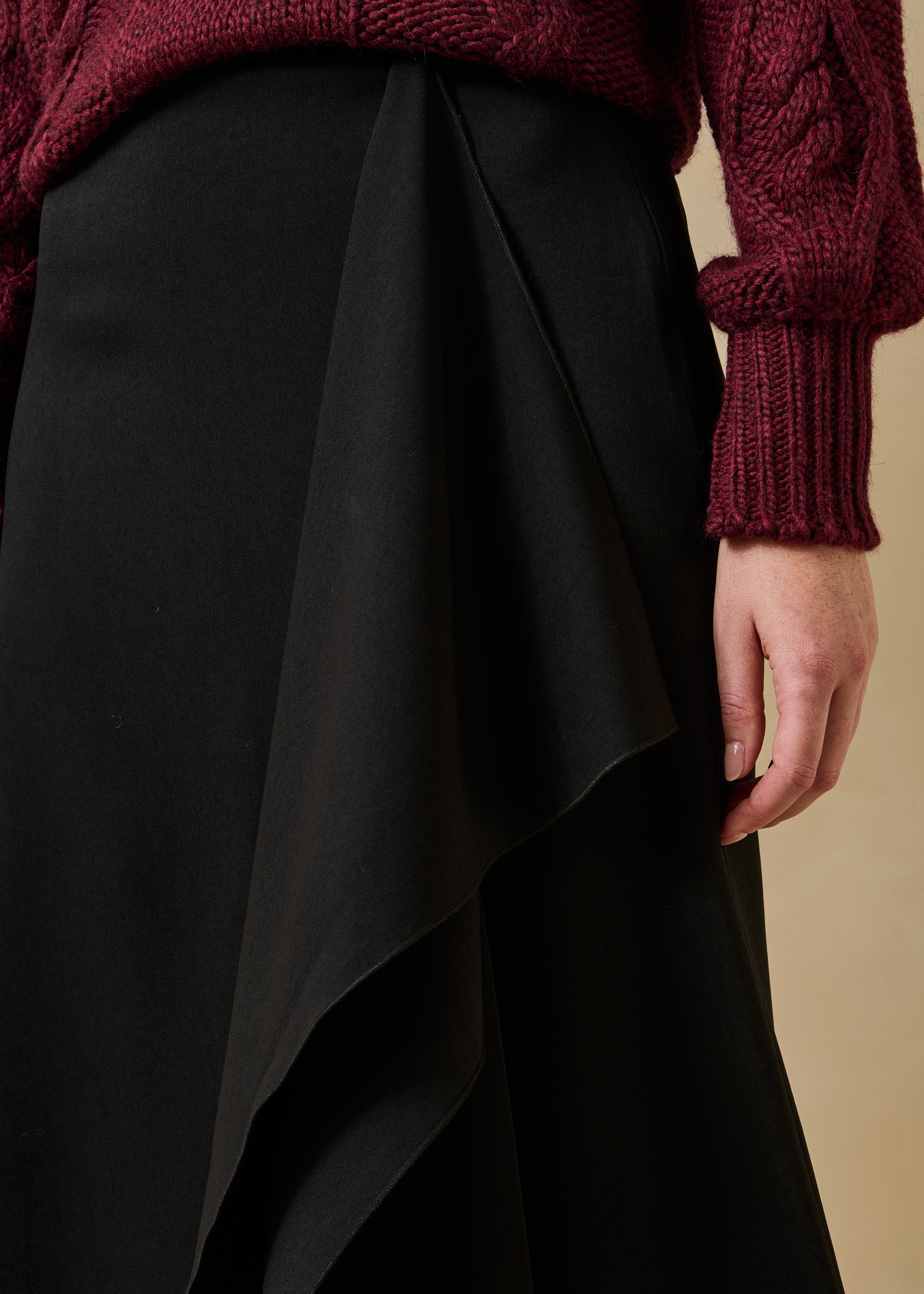 Black high-waisted asymmetrical fluid midi skirt