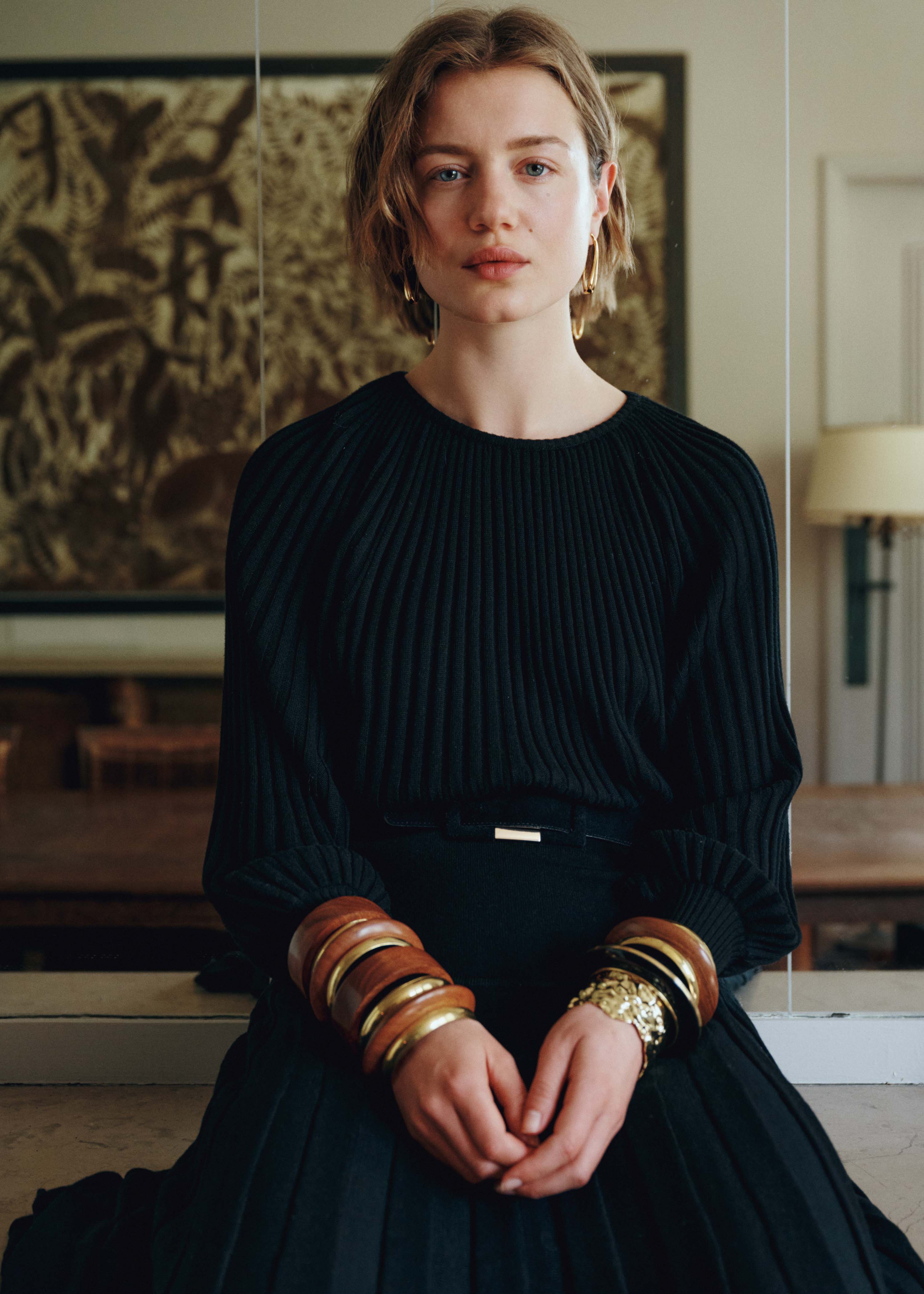 Black pleated knit long sleeve sweater