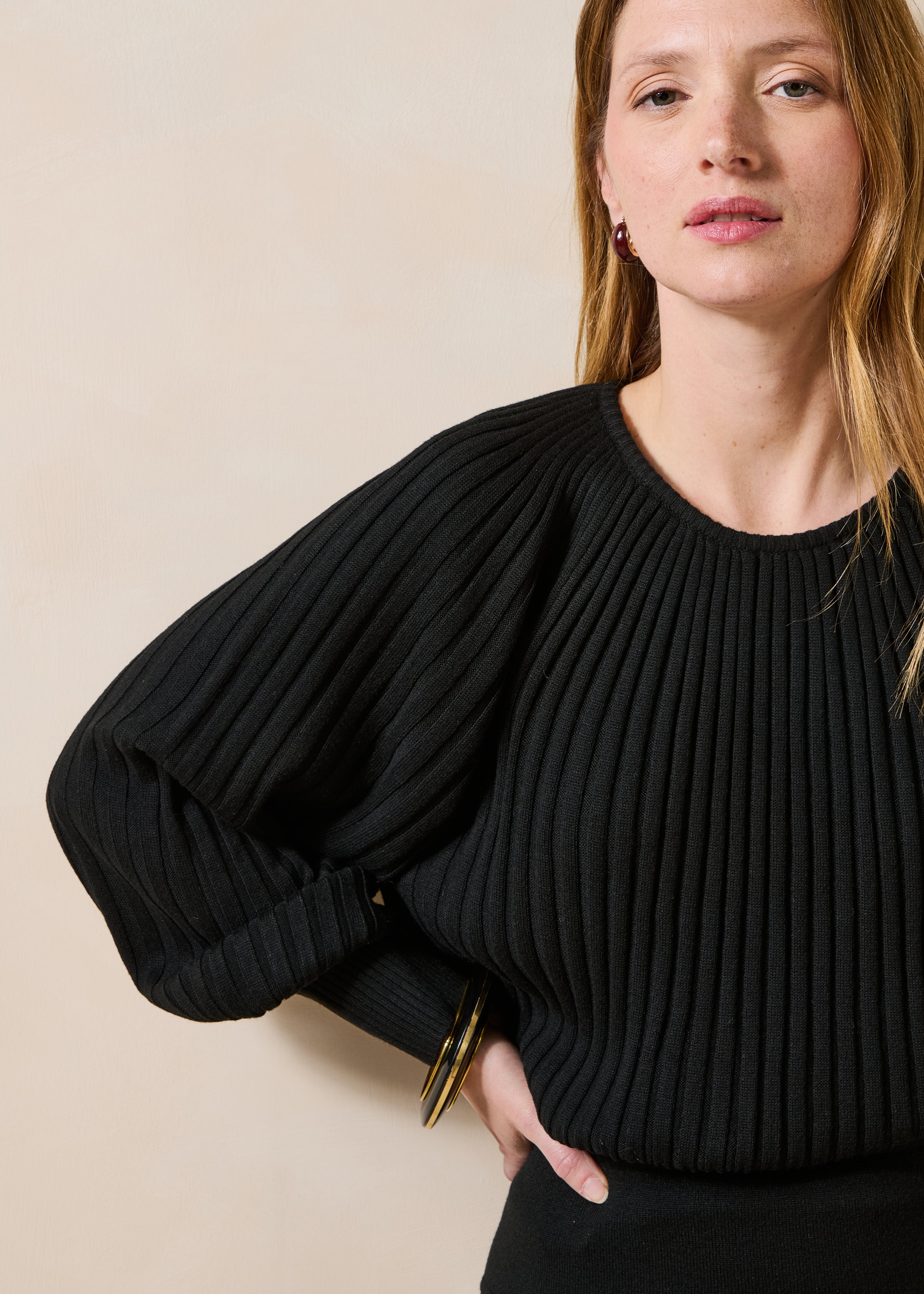 Black pleated knit long sleeve sweater