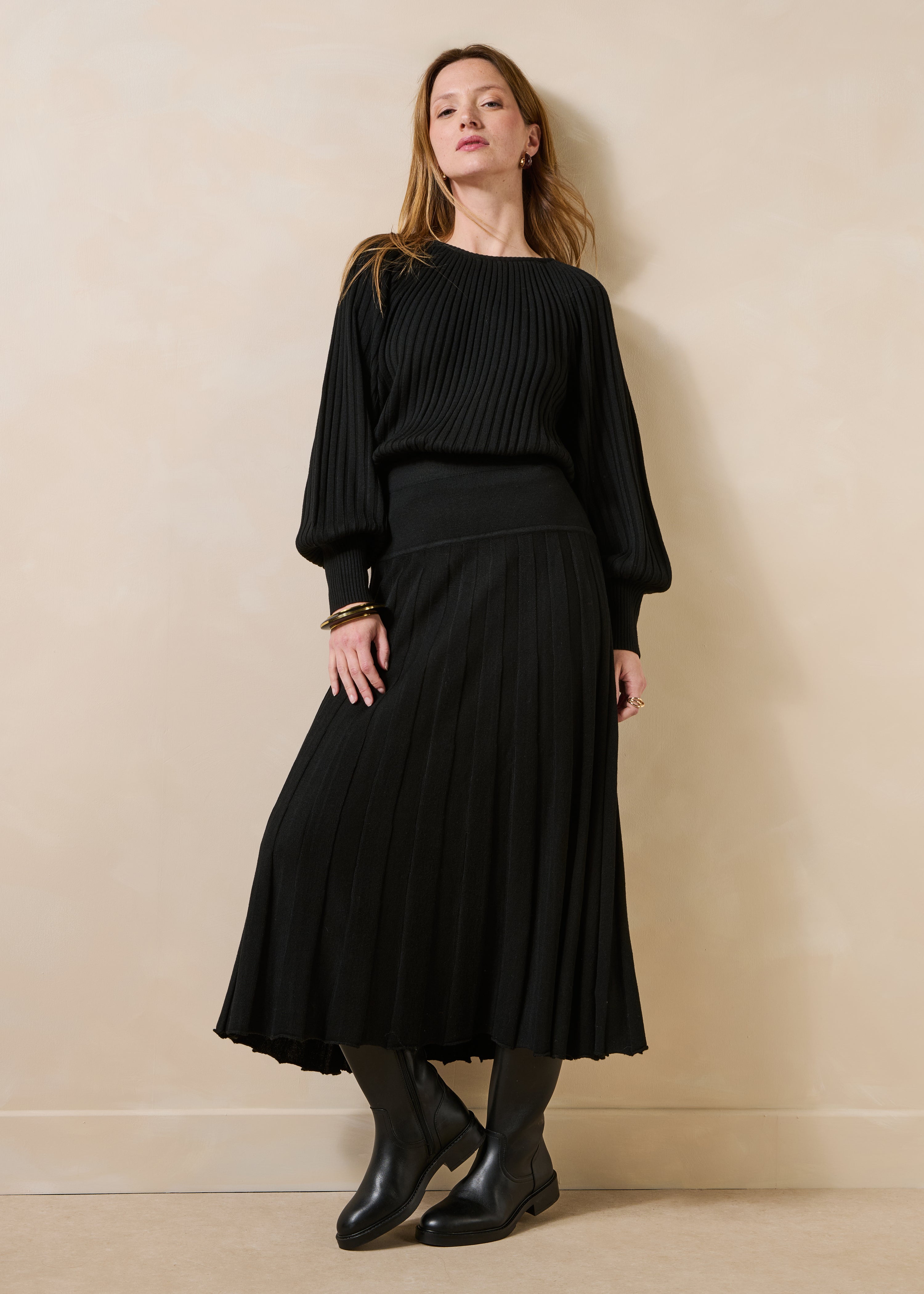 Black pleated knit long sleeve sweater
