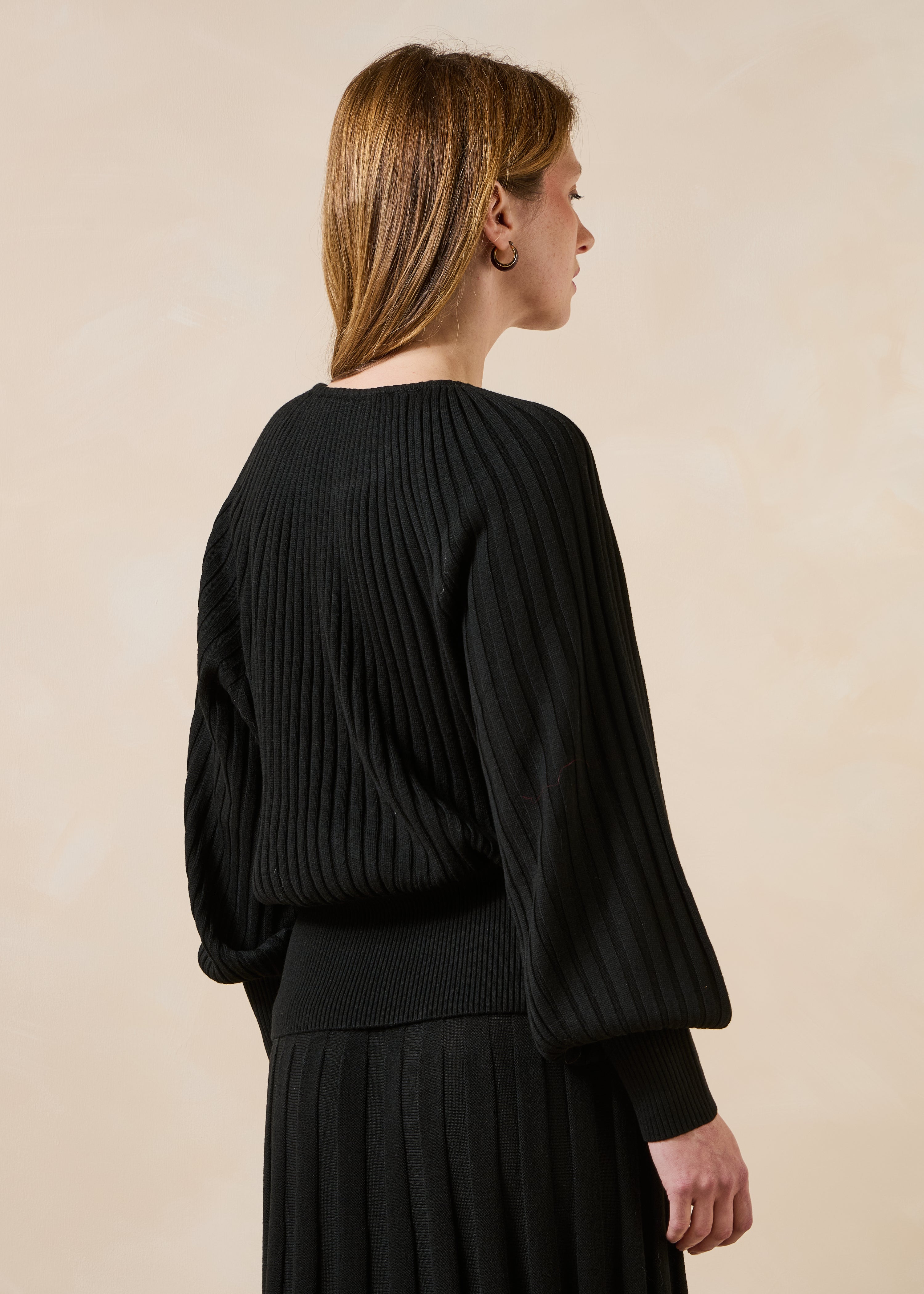 Black pleated knit long sleeve sweater
