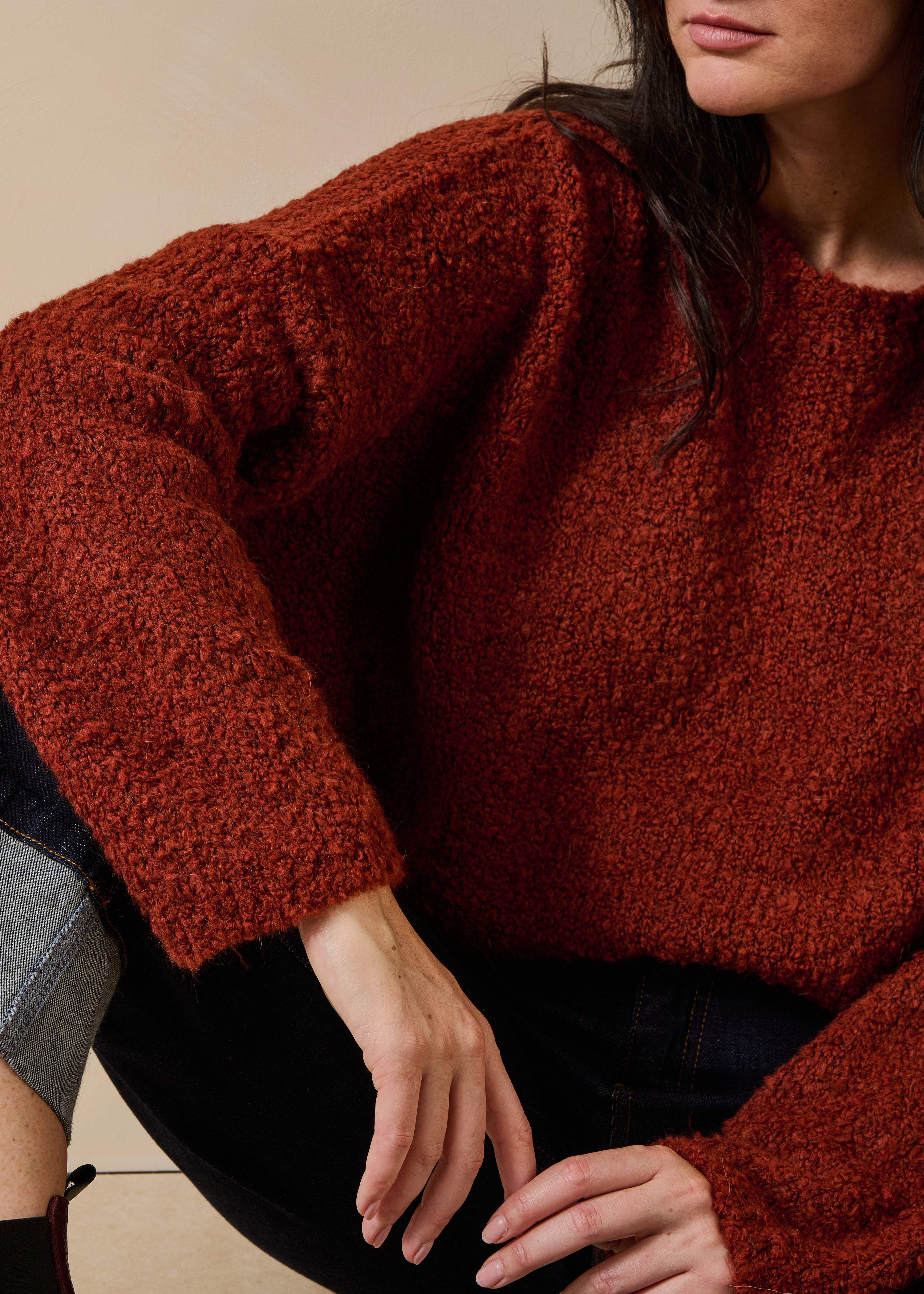 Rust boucle knit long sleeve round neck sweater