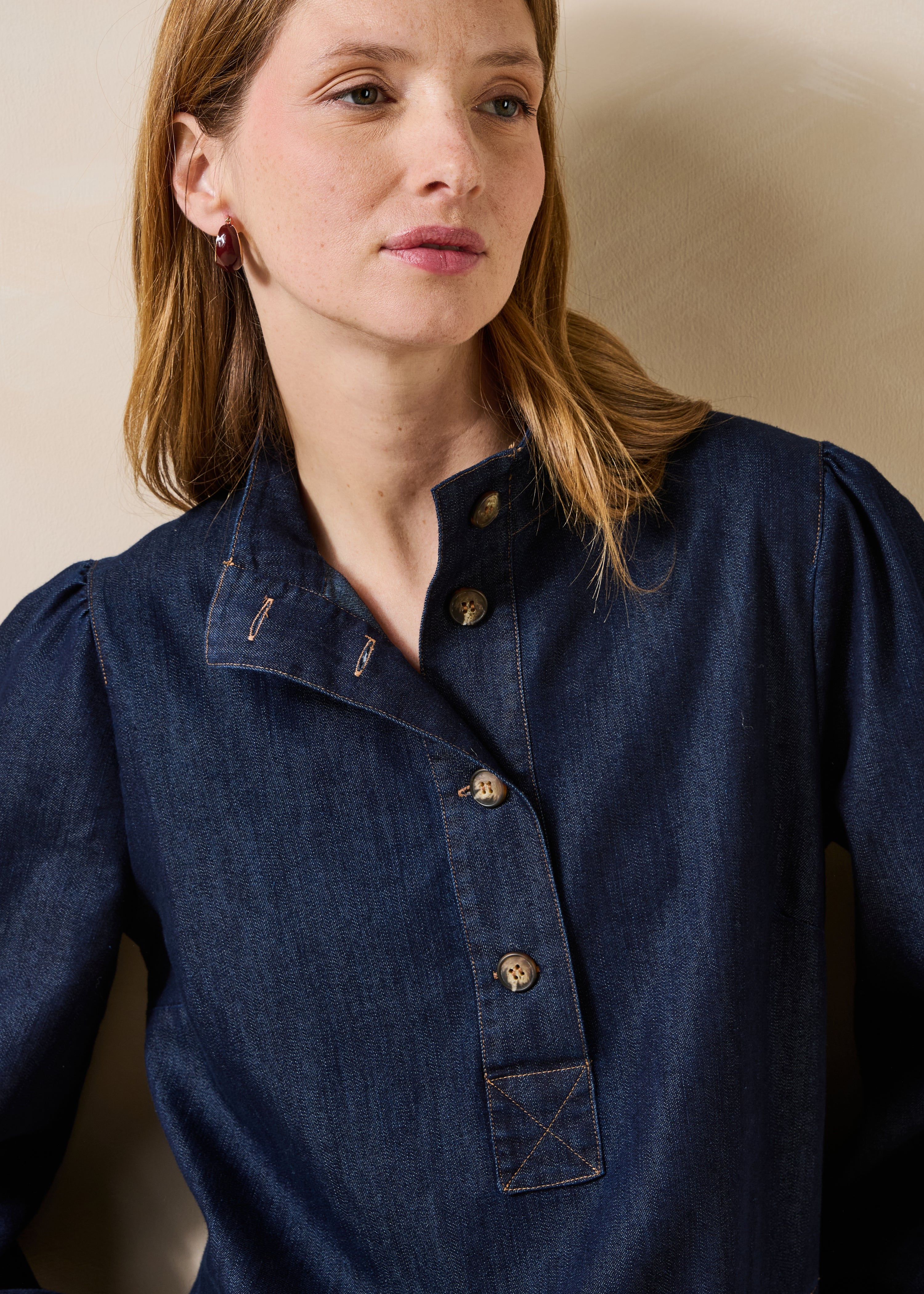 Raw denim short dress with long sleeves and a high collar
