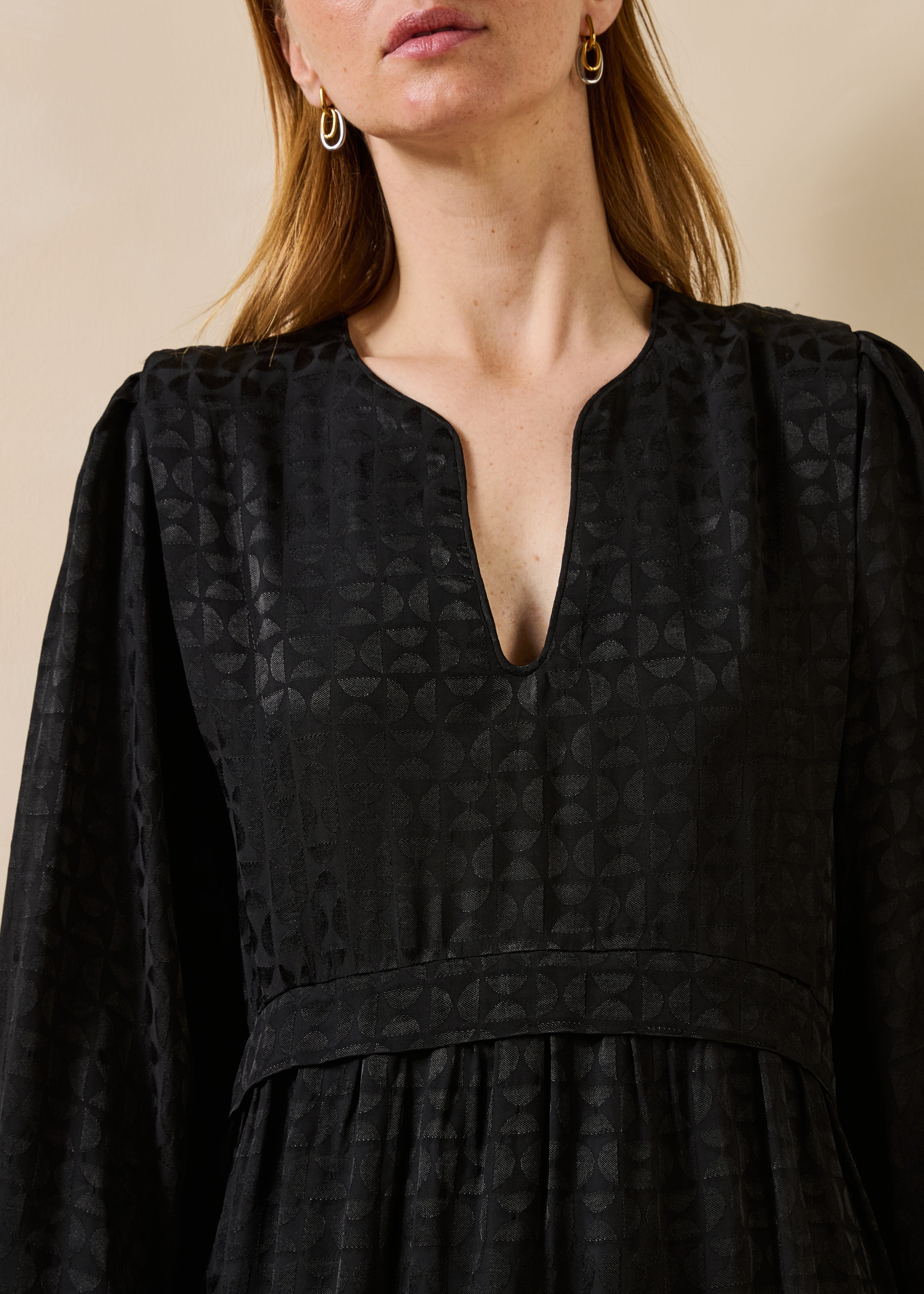 Black short dress with long sleeves and Tunisian neckline