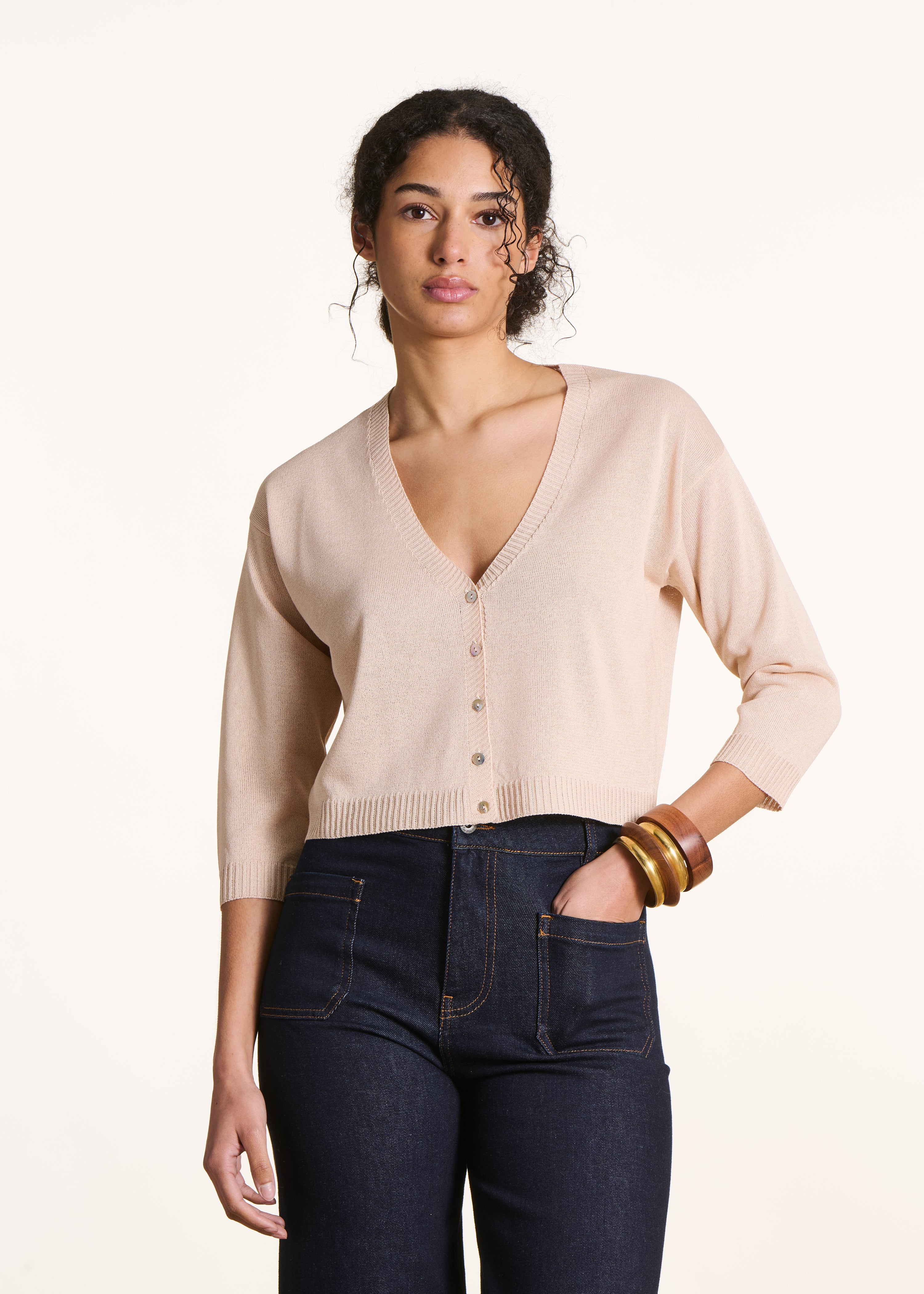 Short pale pink cardigan in fine iridescent knit