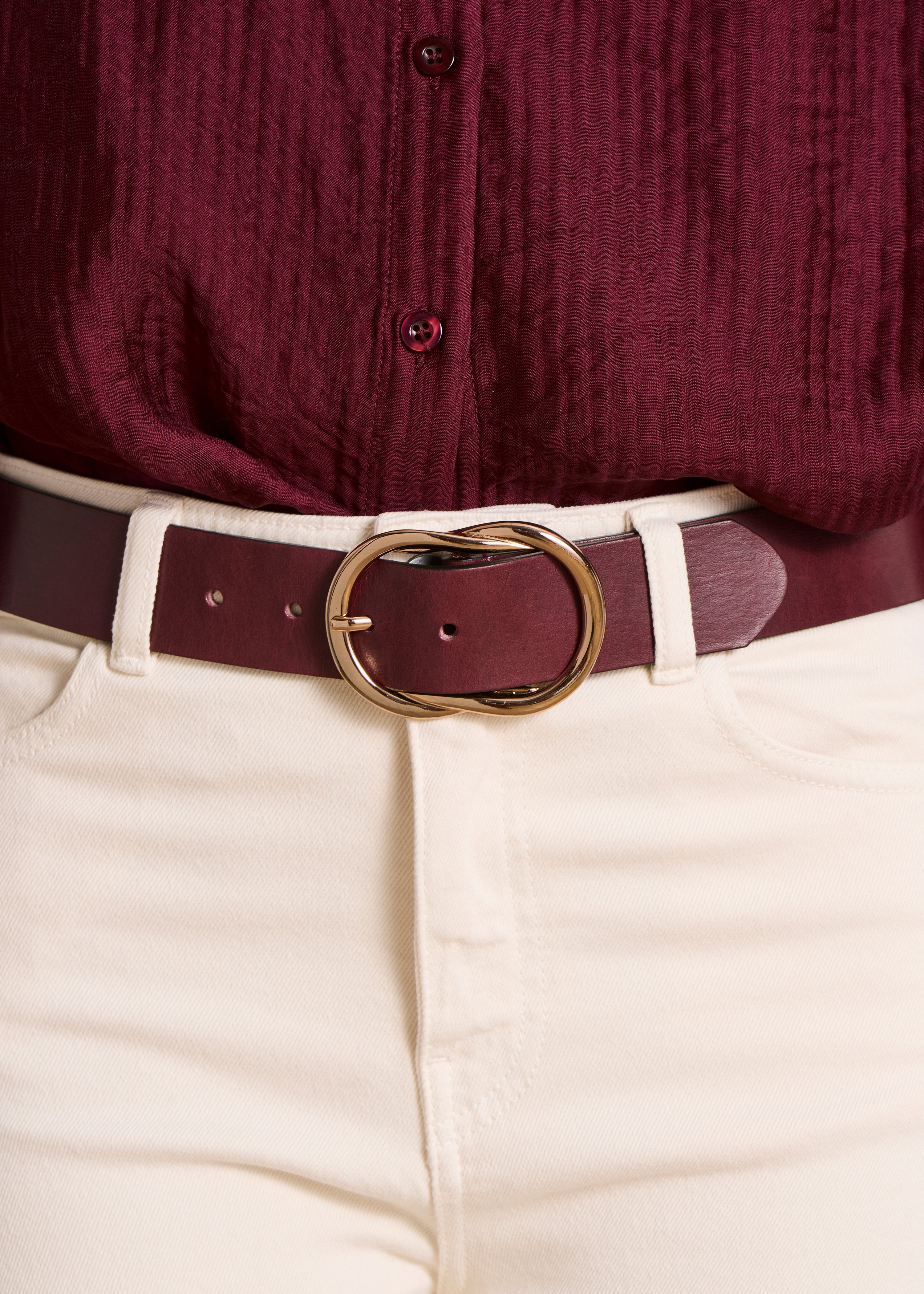 Brown leather belt with decorative buckle