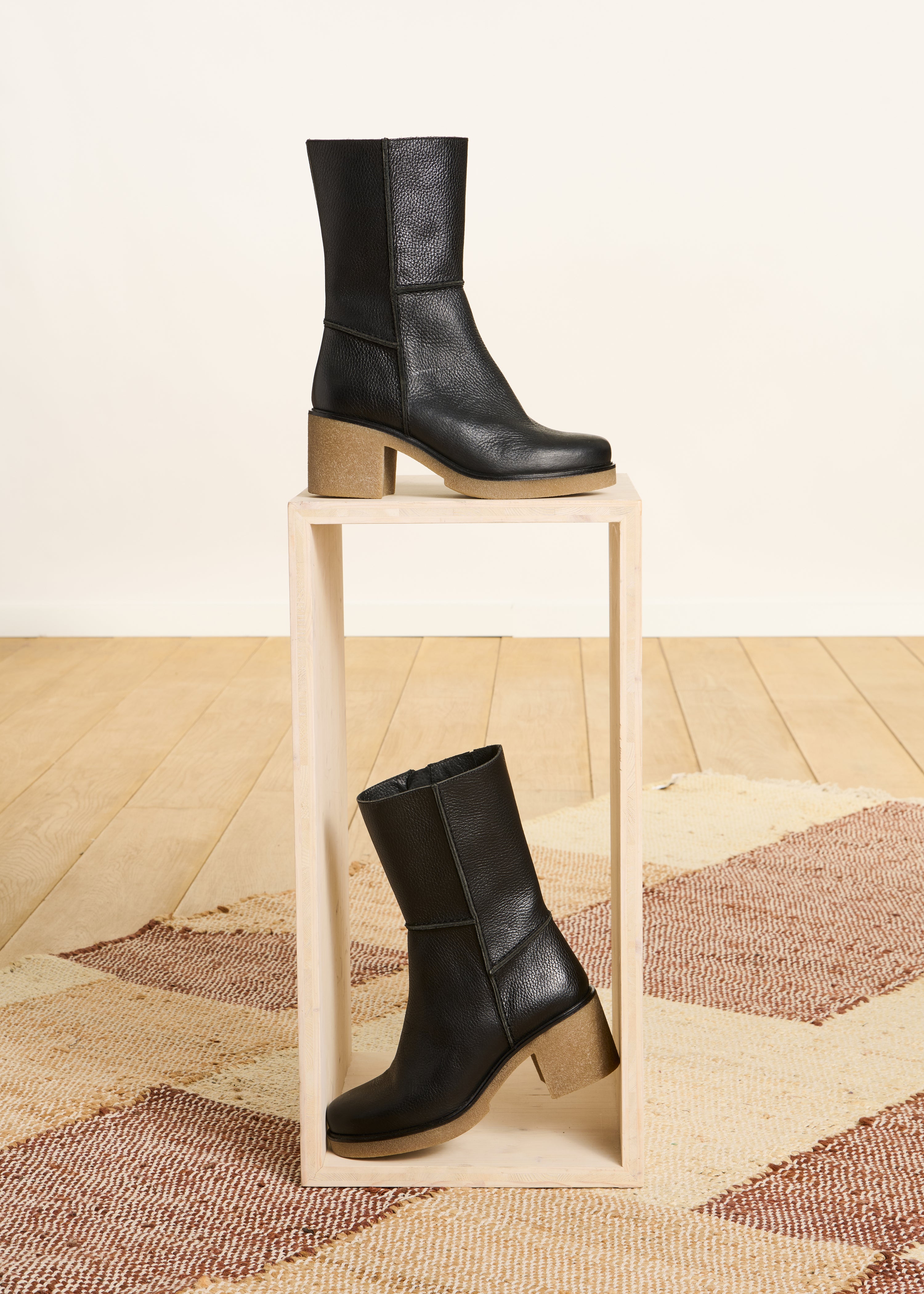 Mid-calf black leather ankle boots