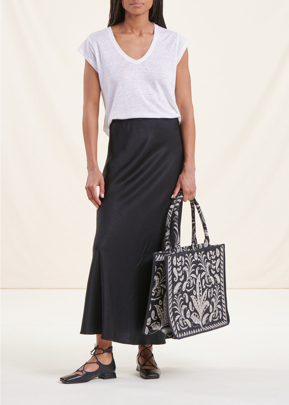 Long flowing black satin skirt