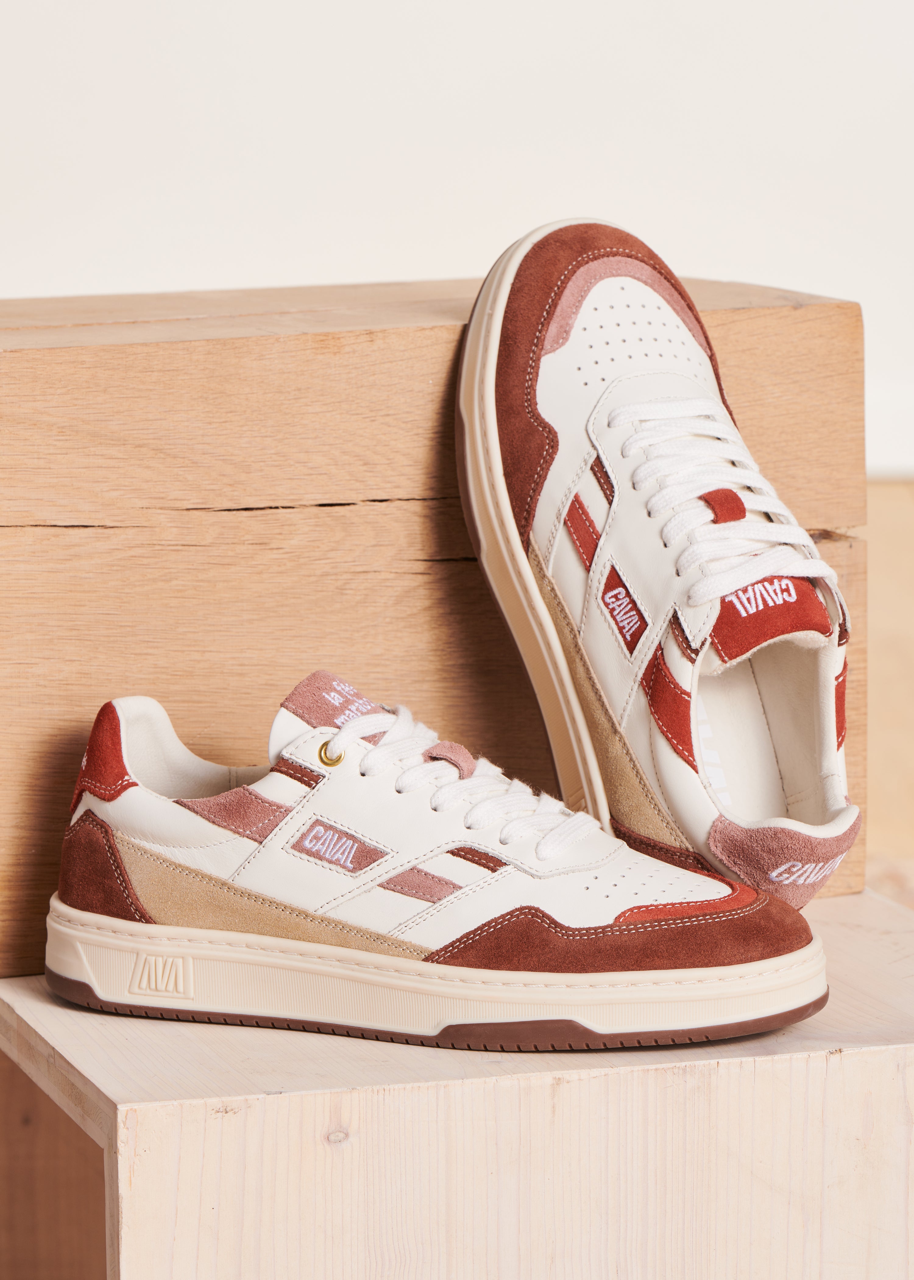 Red asymmetrical leather sneakers
