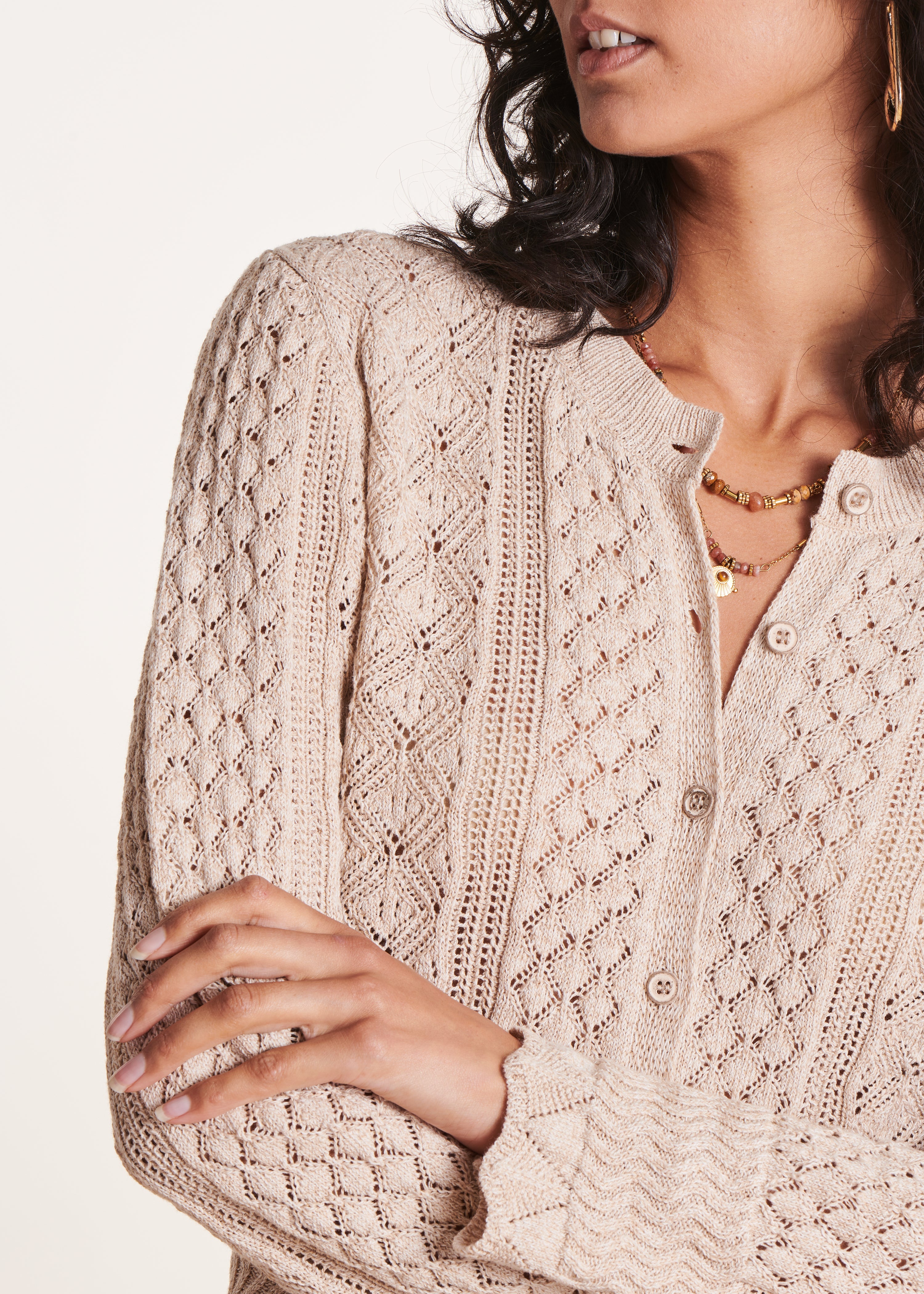 Gilet beige à col rond en maille chinée