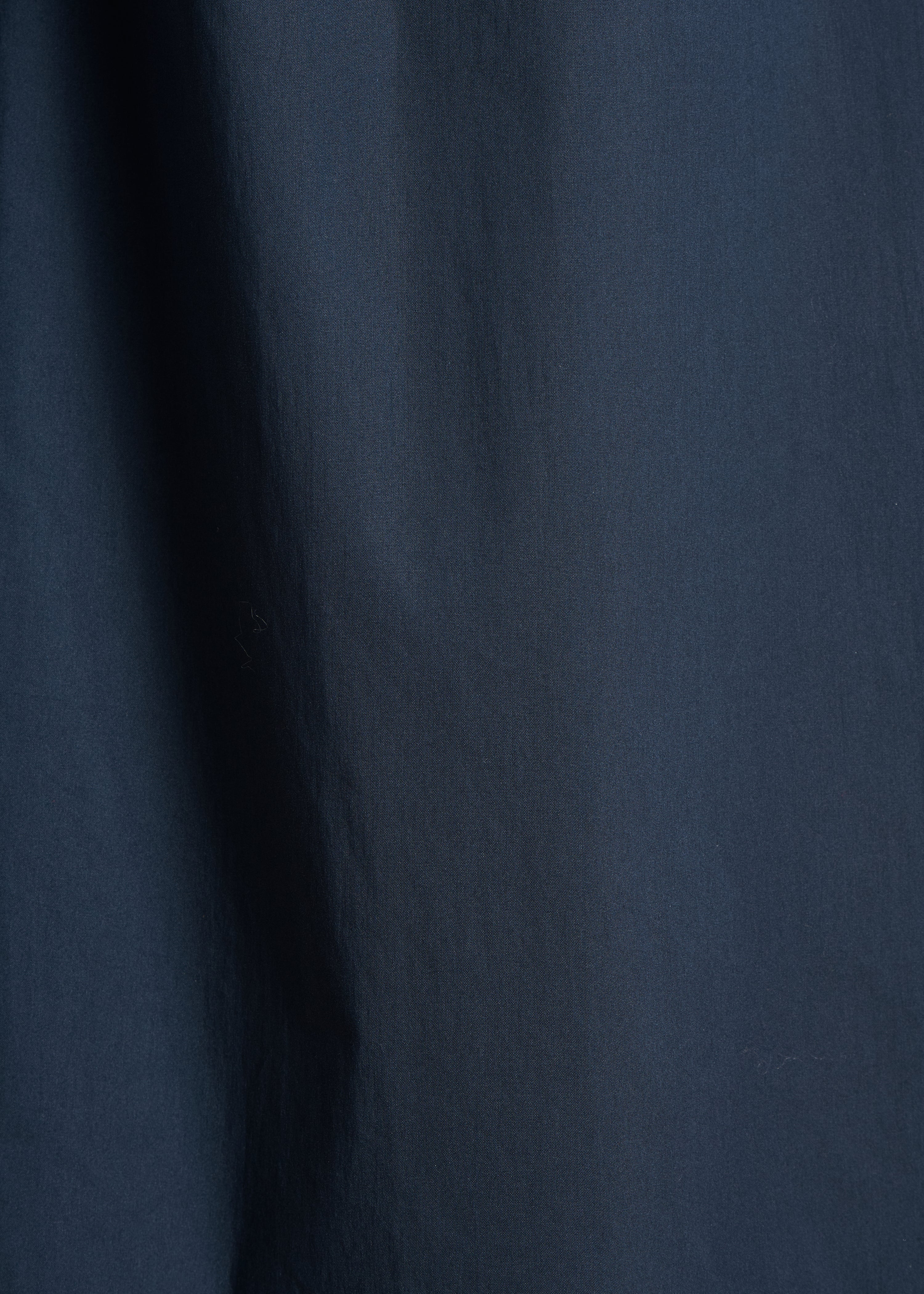 Wide navy blue 7/8-length trousers with tie belt