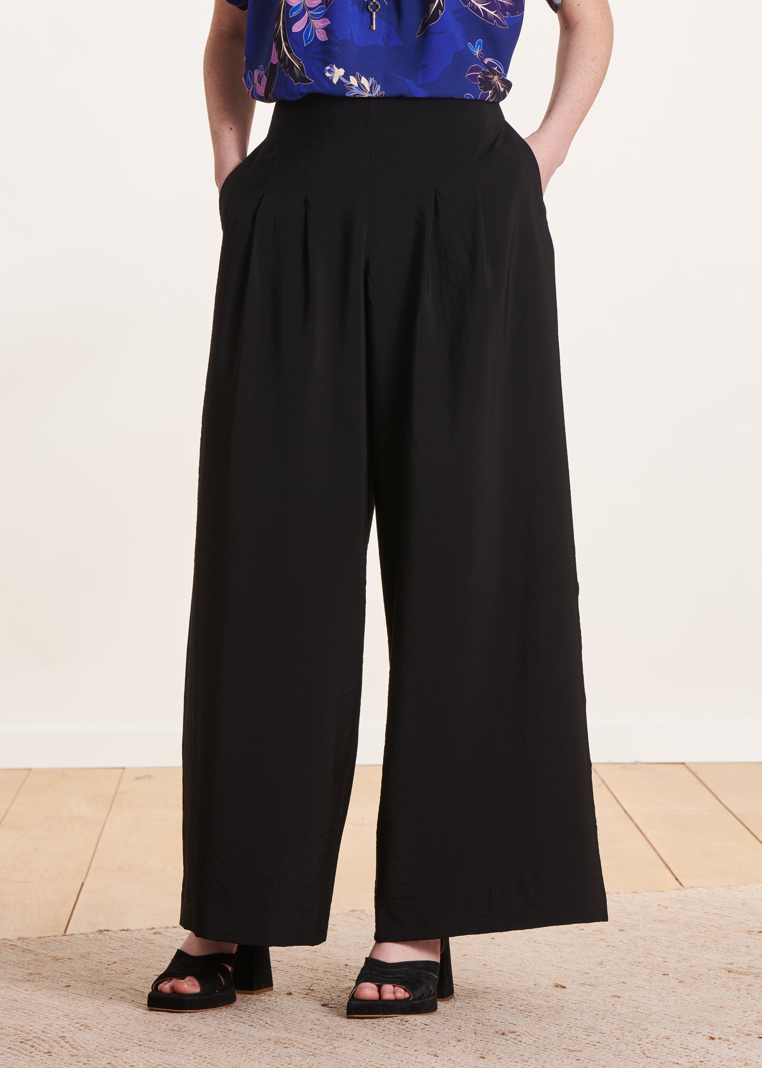 black high-waisted trousers