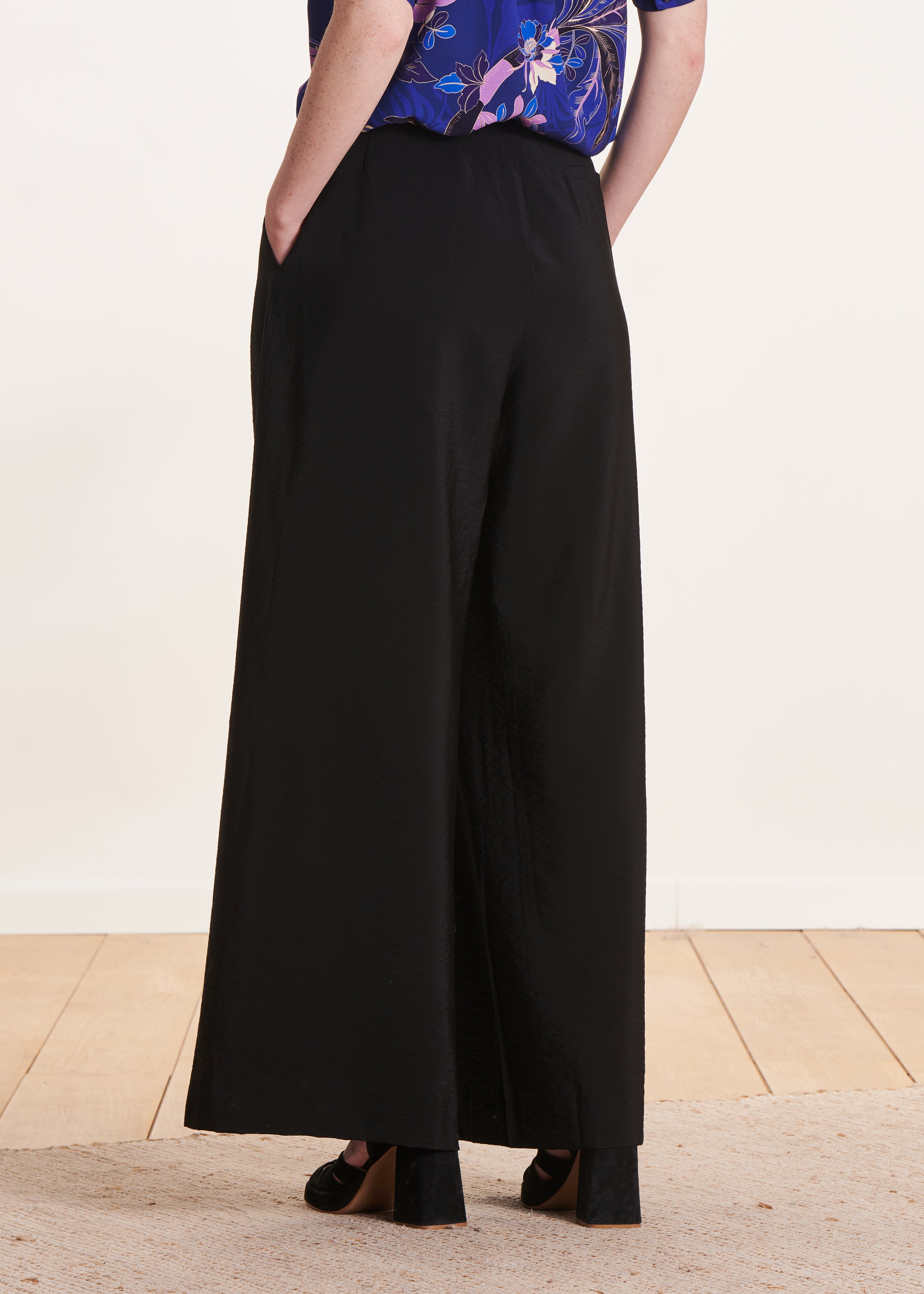 black high-waisted trousers