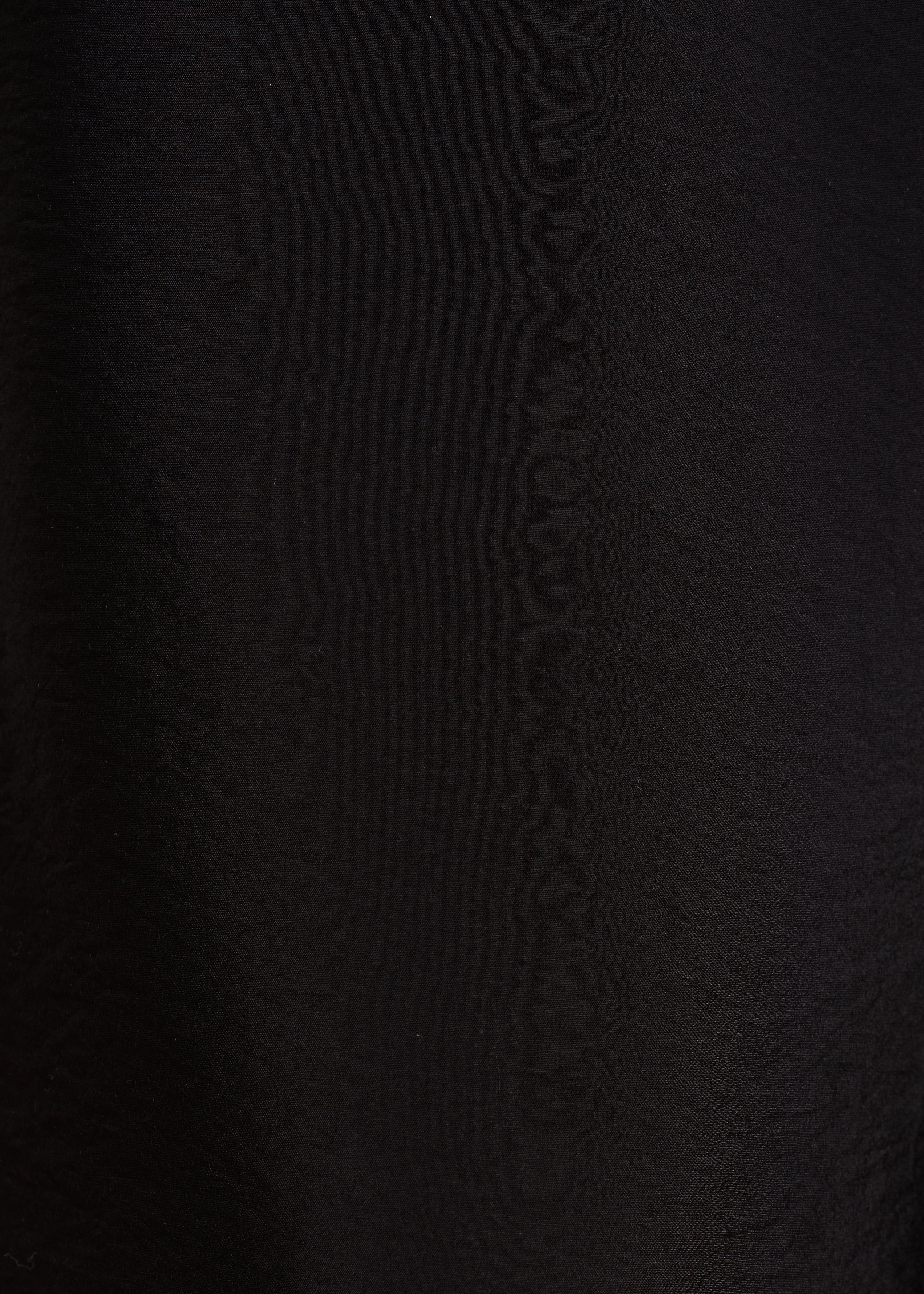 black high-waisted trousers