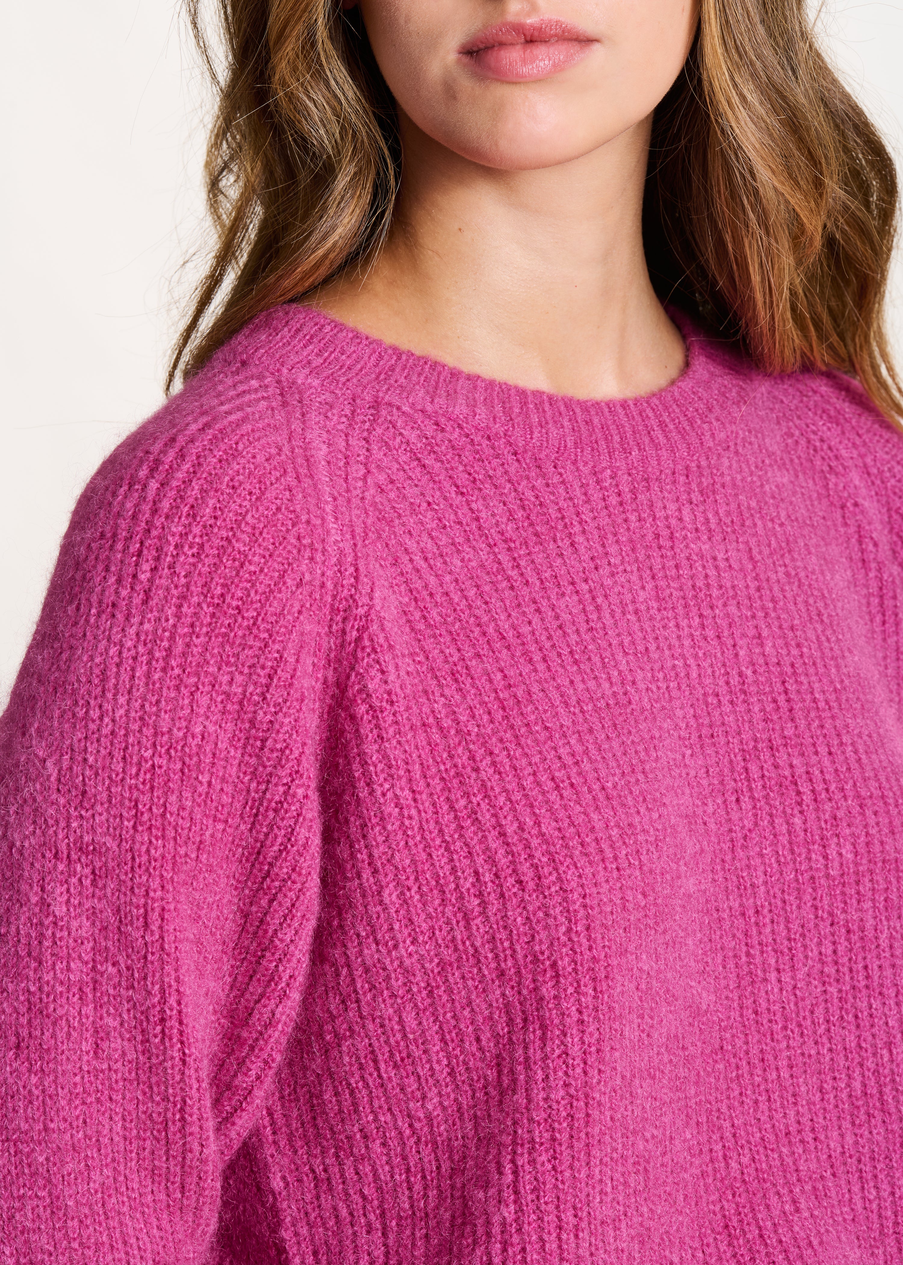 Fuchsia pink long sleeve round neck ribbed knit sweater