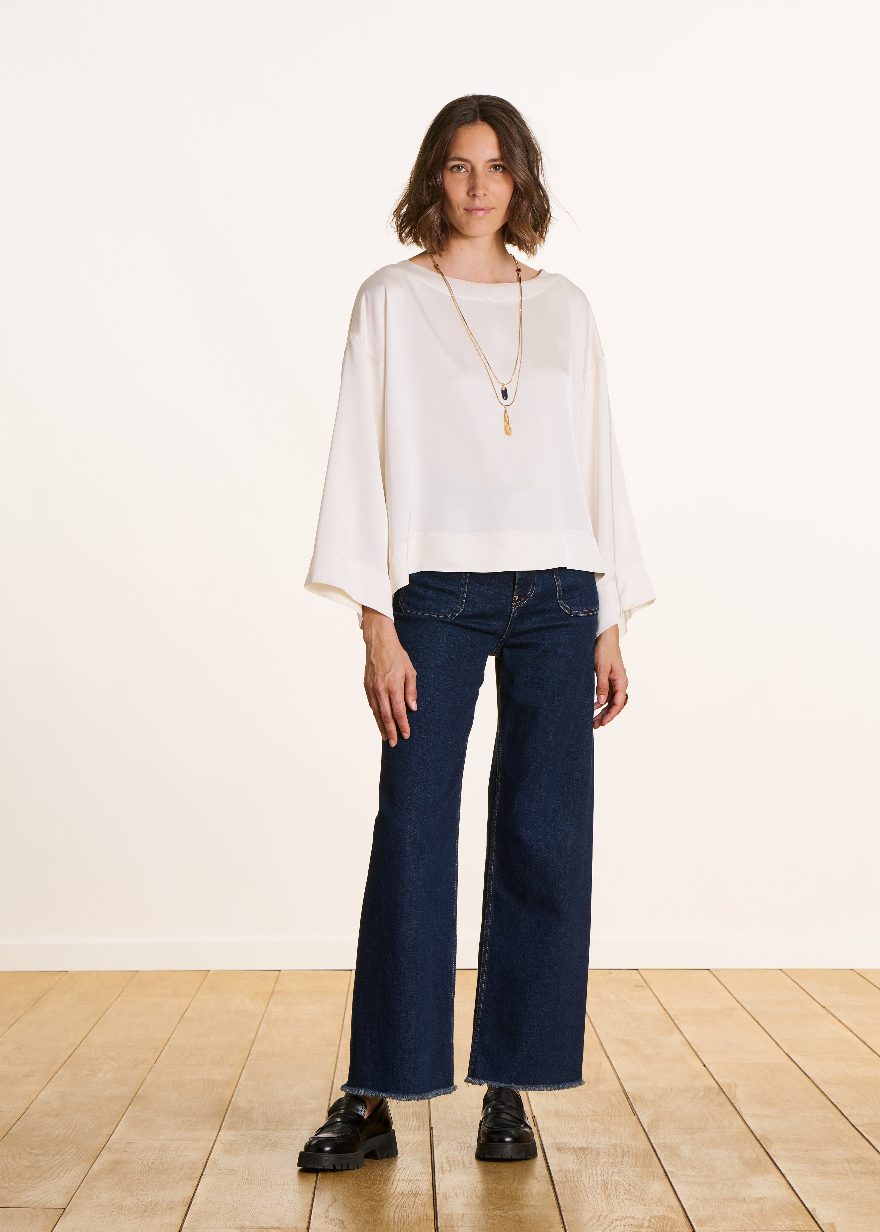 Loose off-white satin top with long sleeves