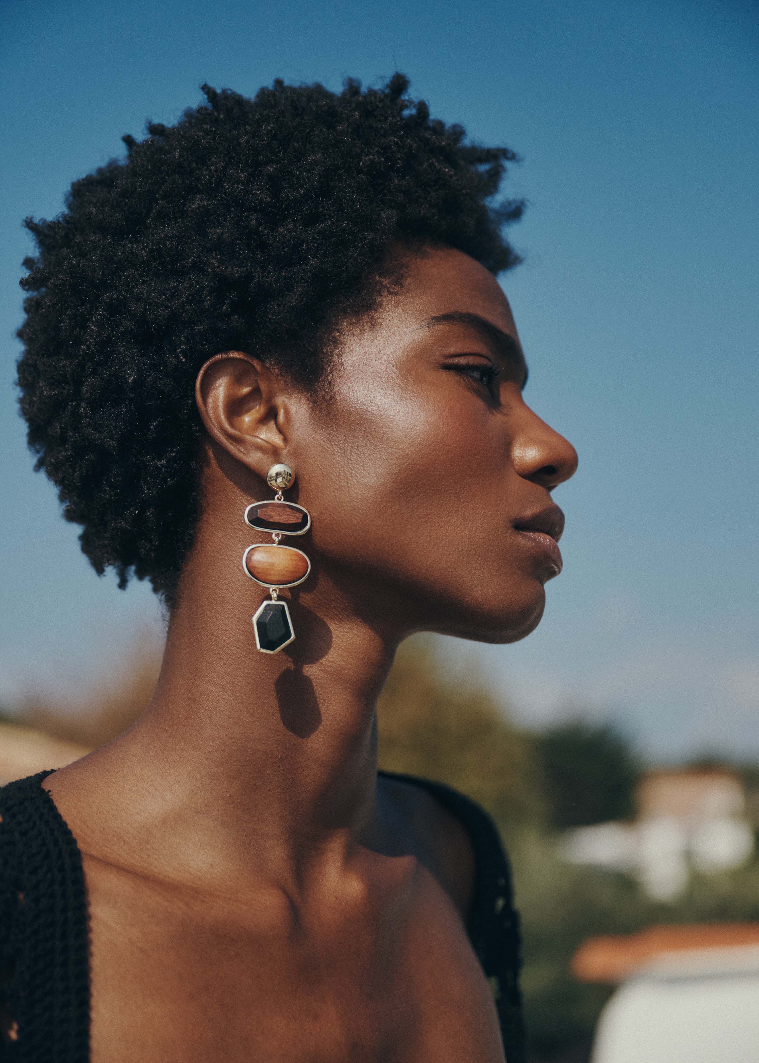 Gold dangling earrings with wood