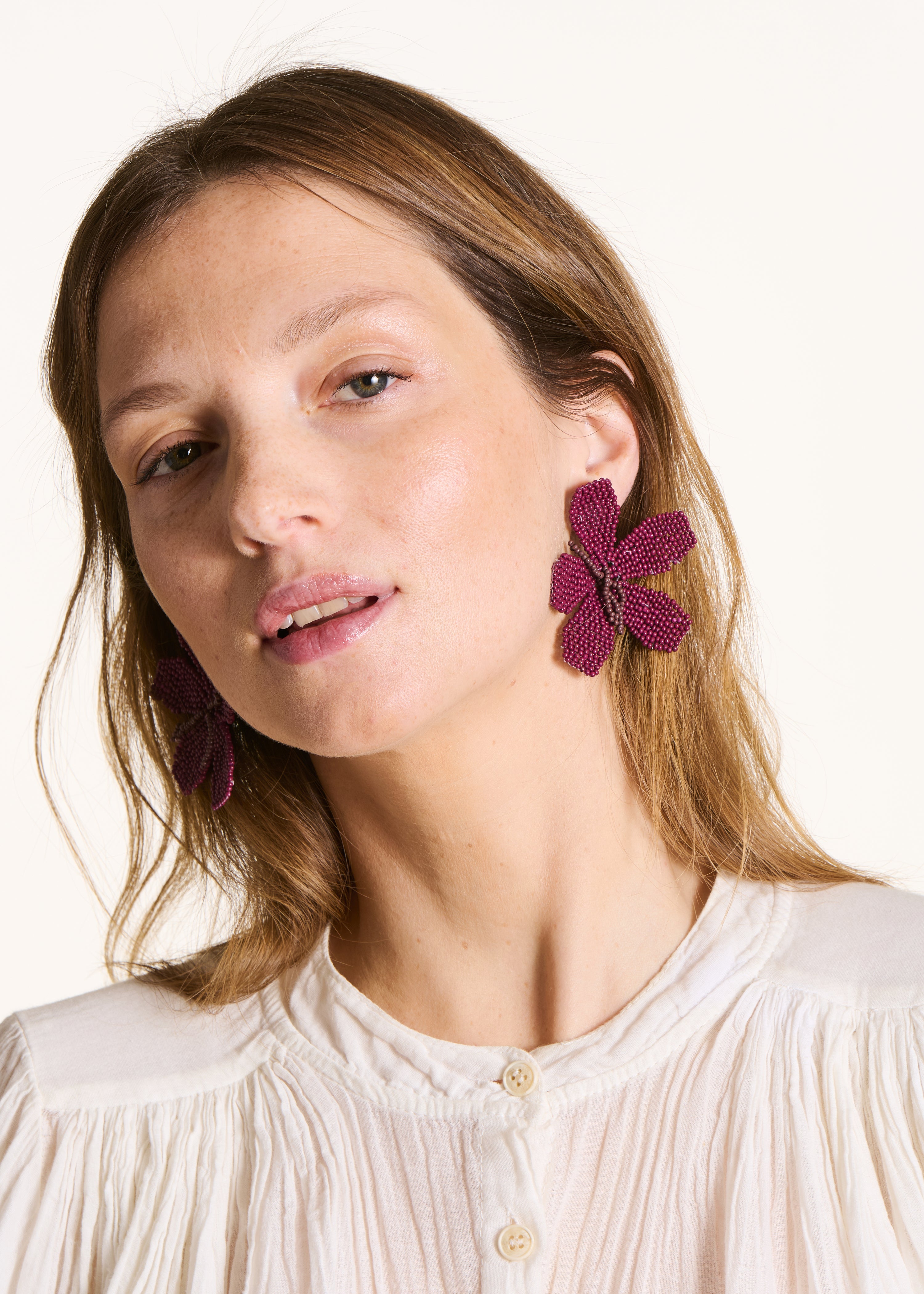 Flower earrings with purple pearls