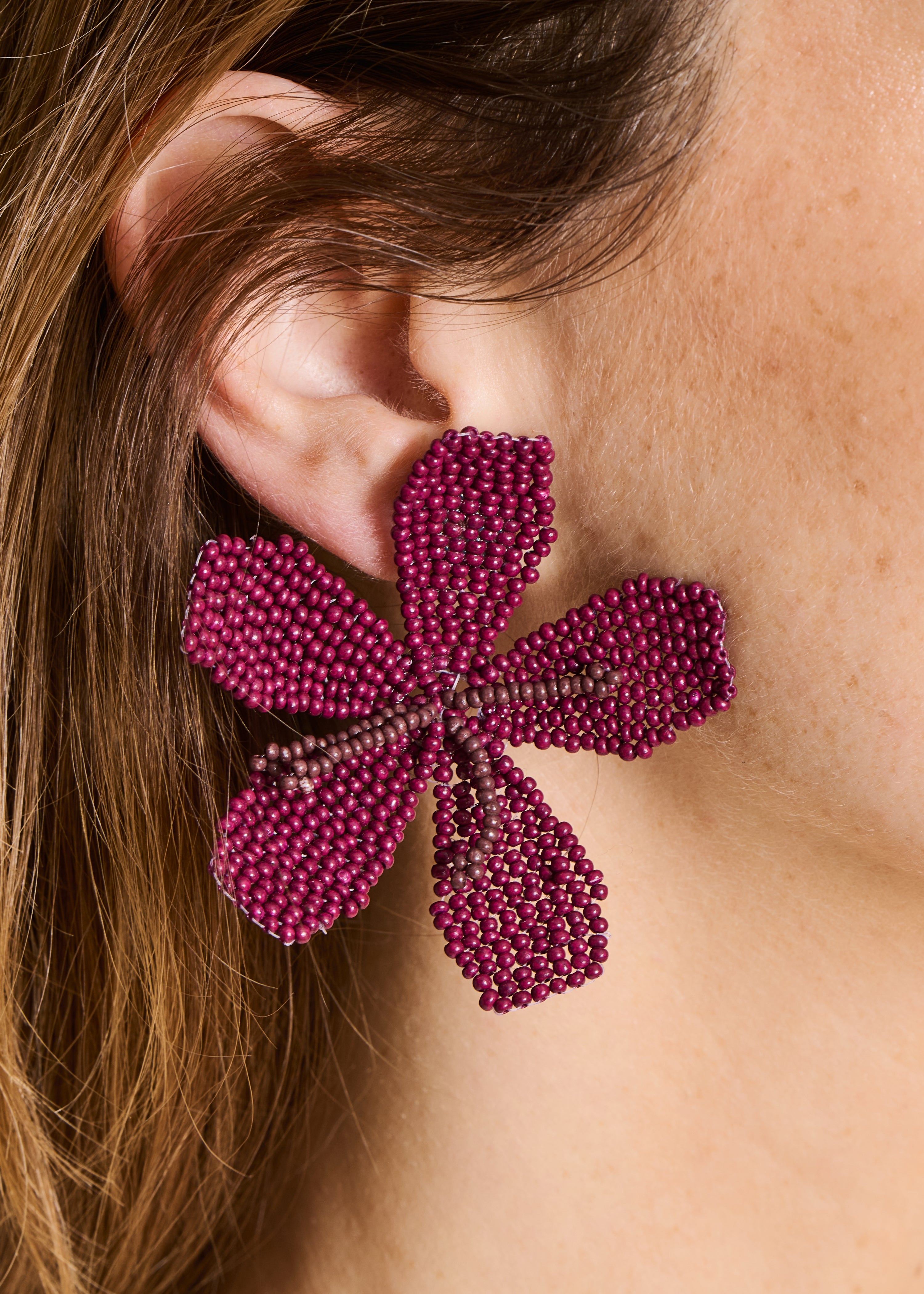 Flower earrings with purple pearls