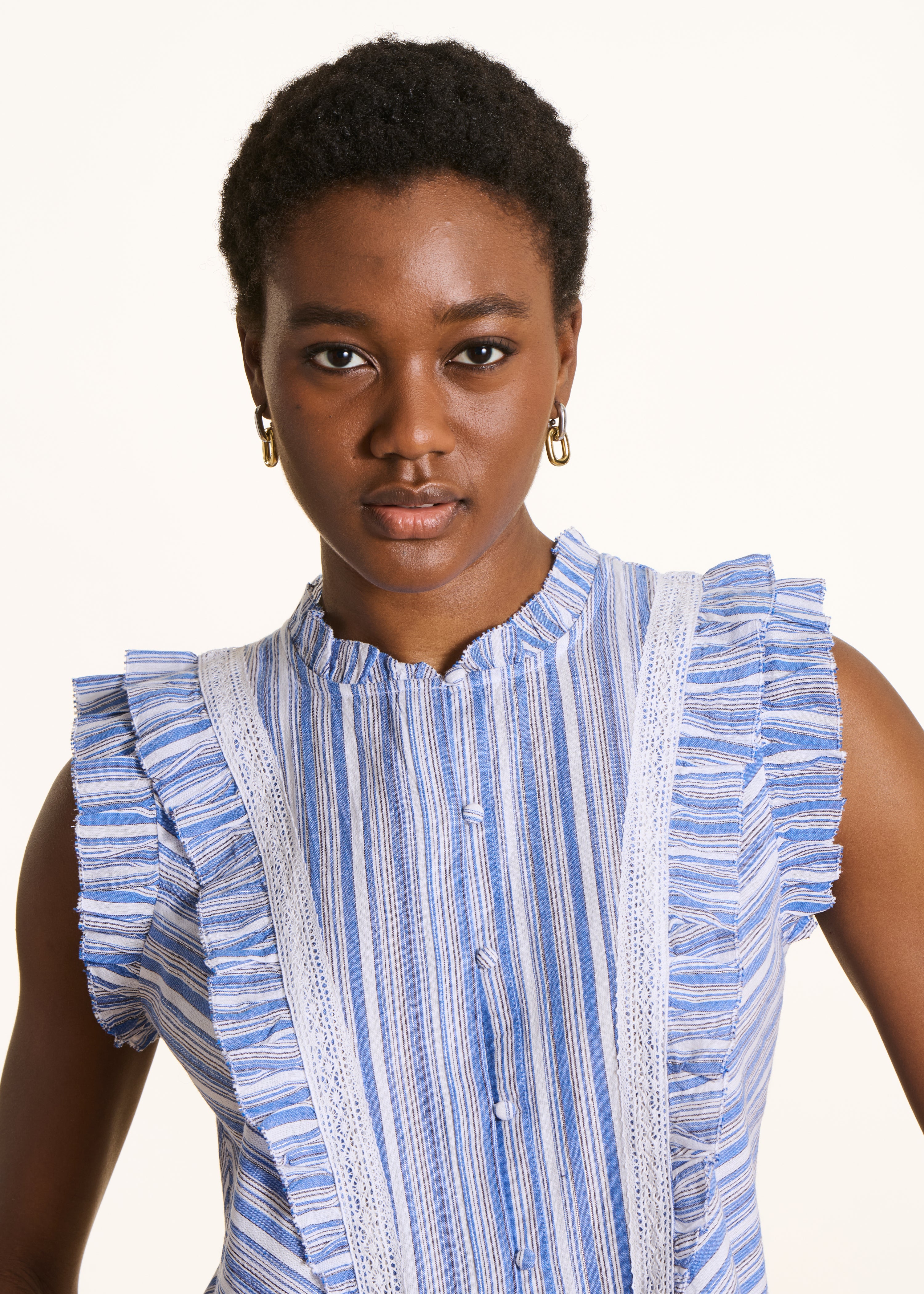 Blue striped sleeveless ruffle shirt
